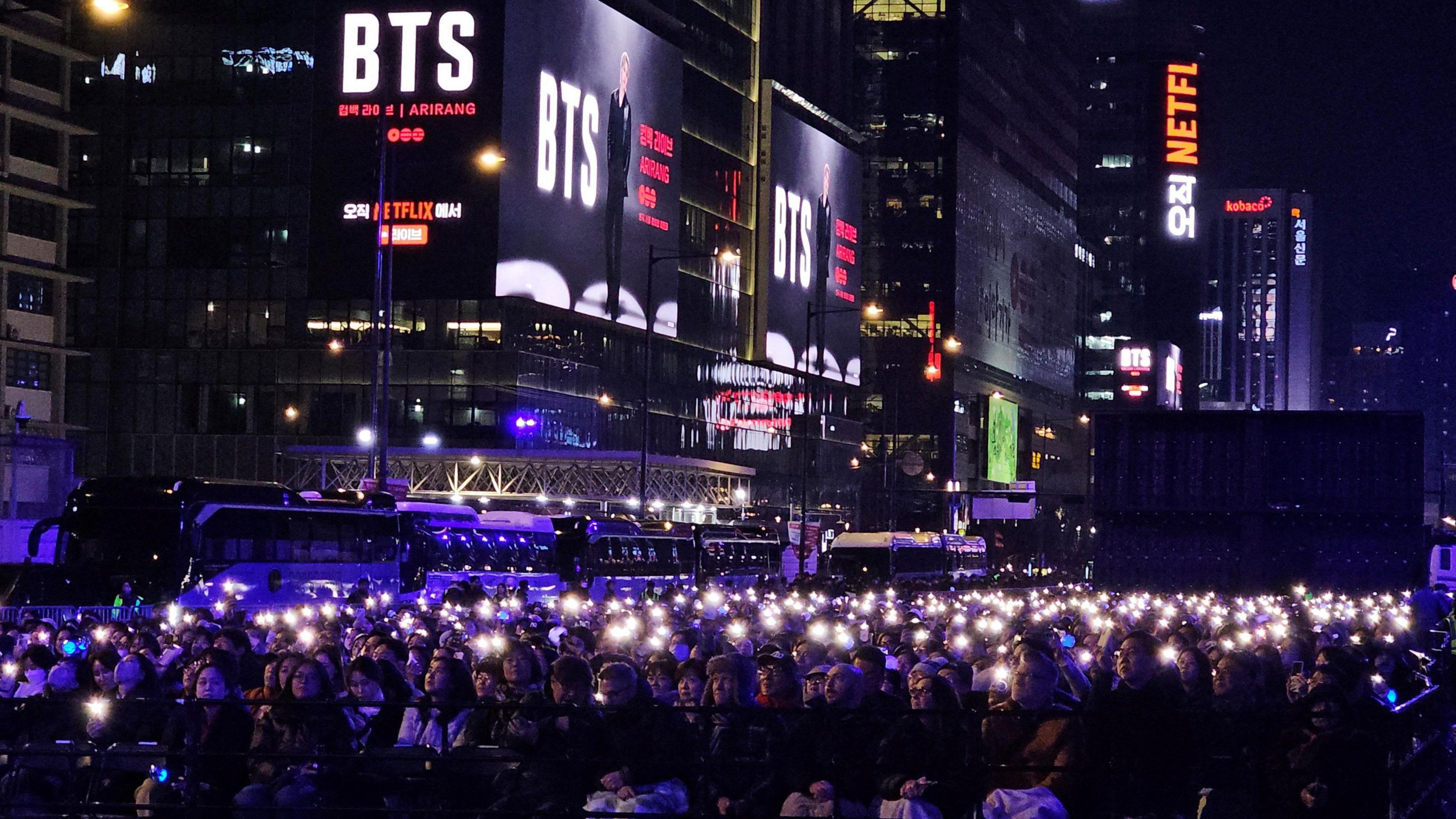 a crows in south korea watching BTS.