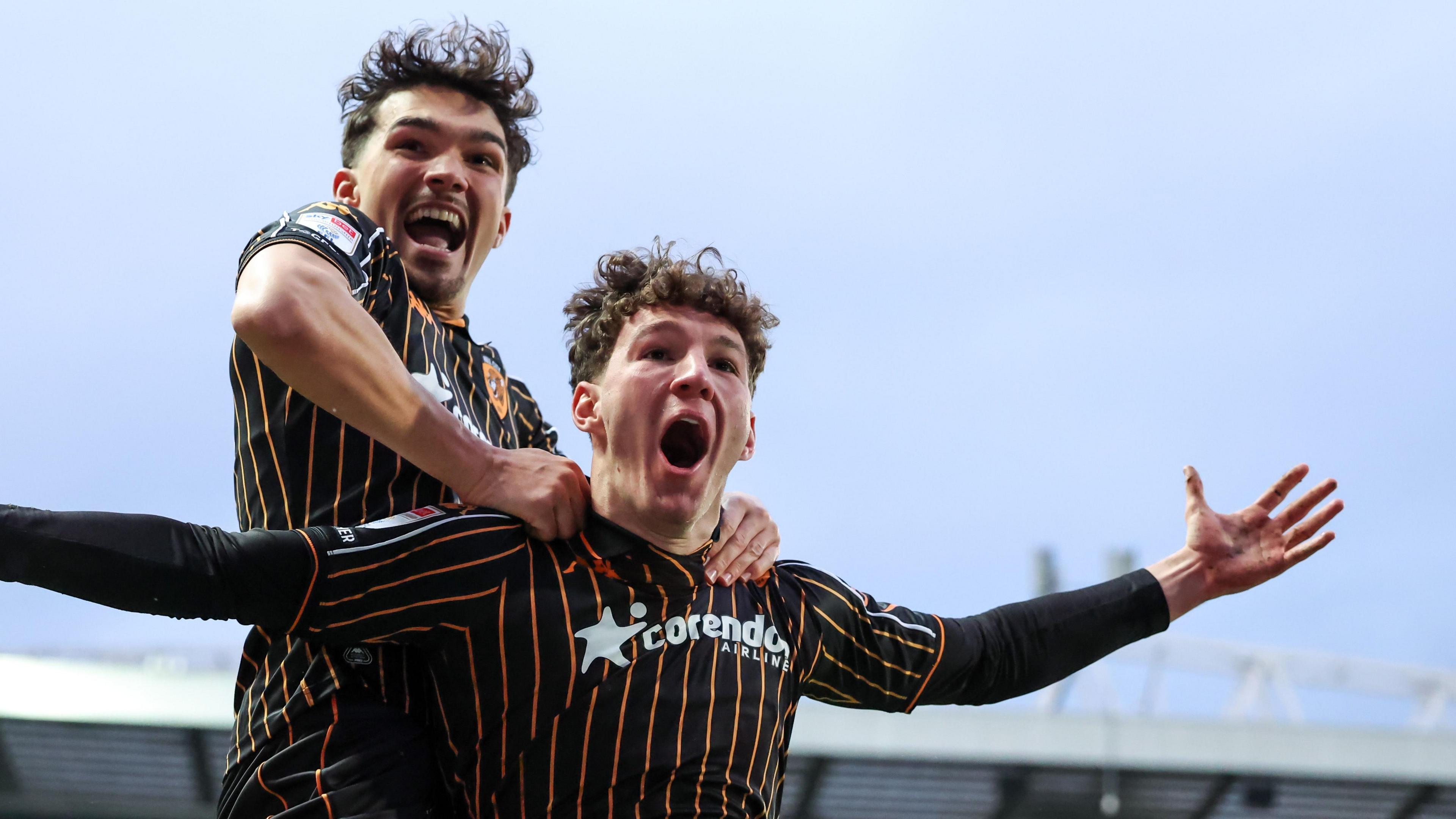 Lewis Koumas celebrating