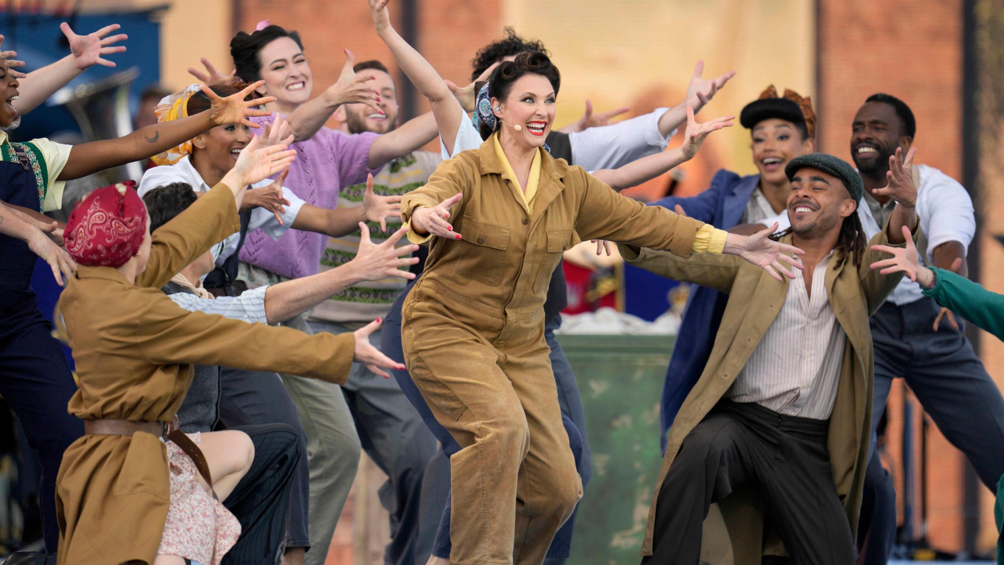 Singer Emma Barton and dancers perform at the UK's national commemorative event for the 80th anniversary of D-Day