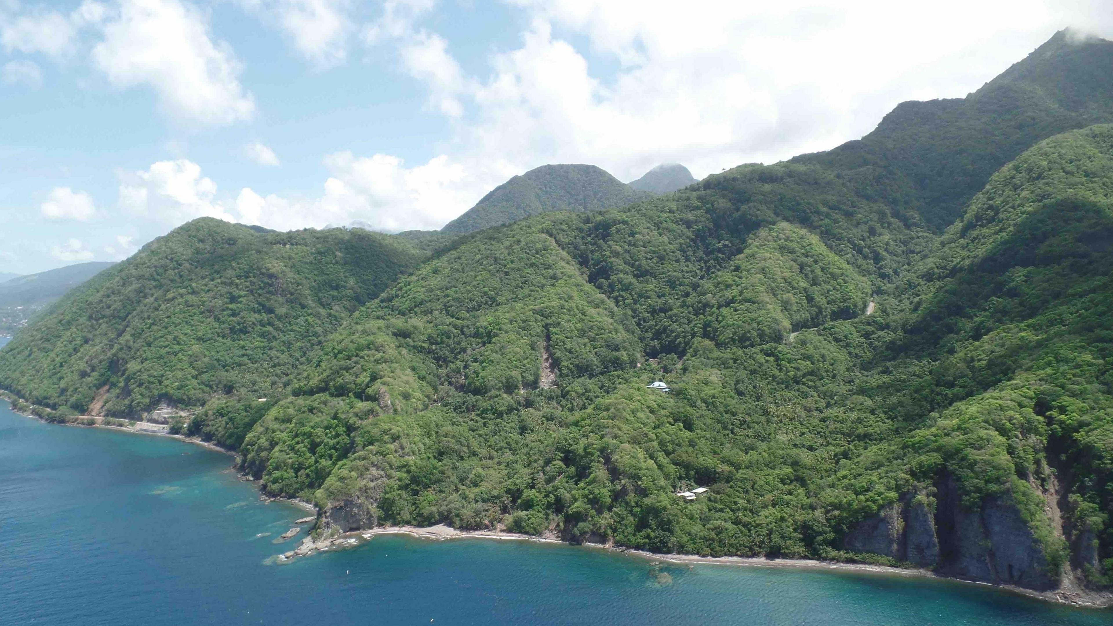 An aerial photo of part of Dominica's mountainous coastline