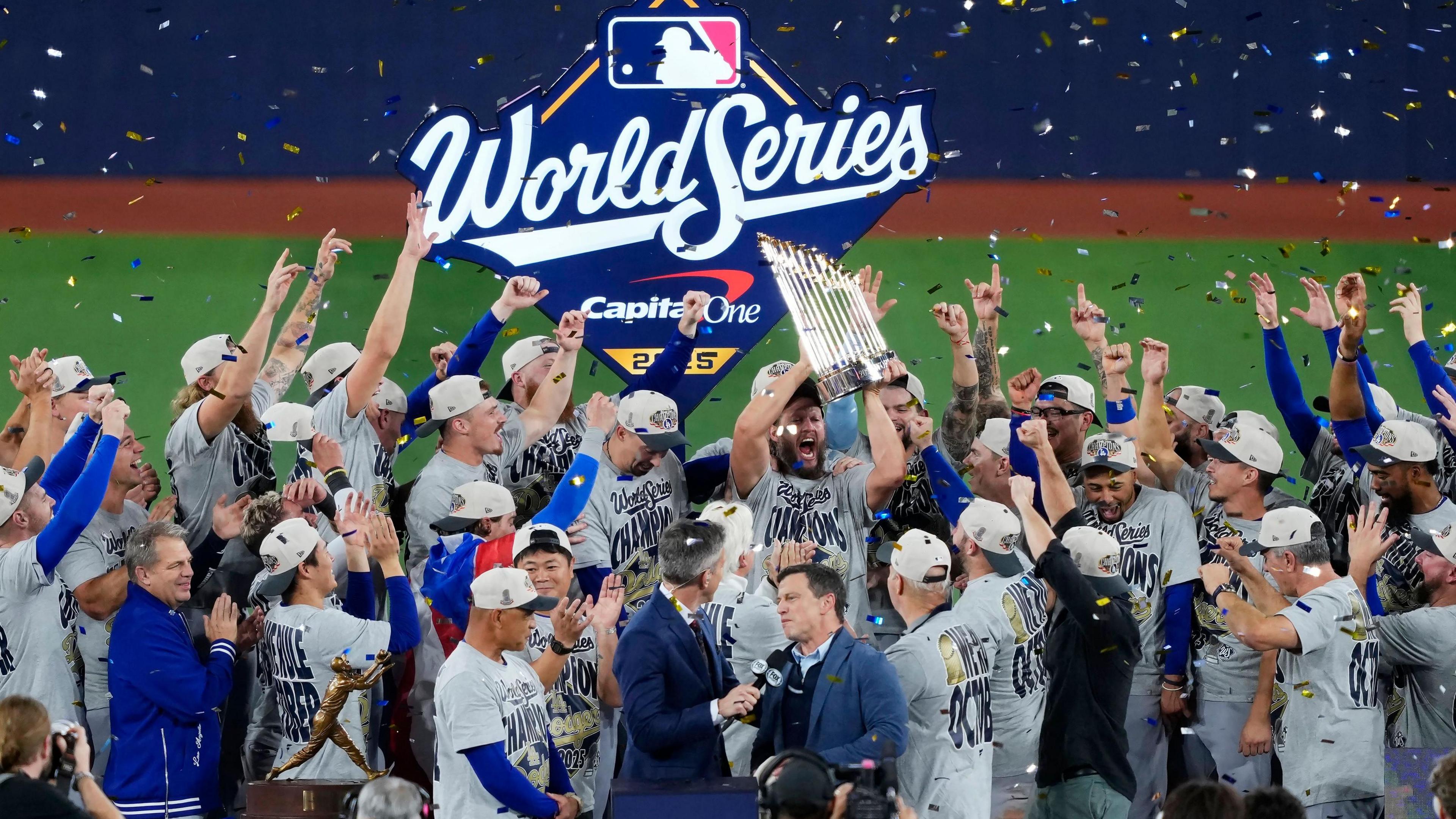The Los Angeles Dodgers celebrate with the World Series trophy