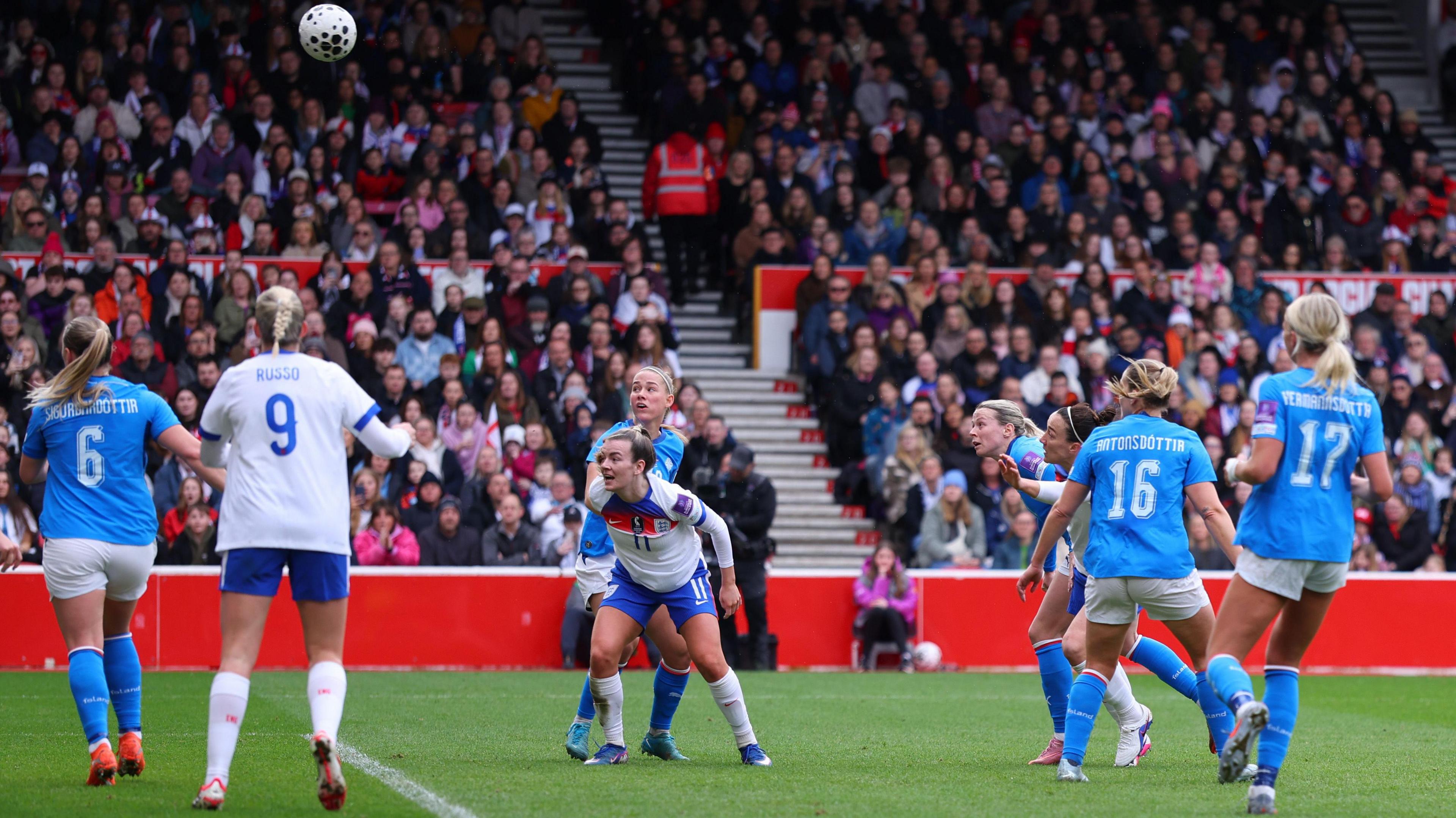 Lucy Bronze (third right) scores