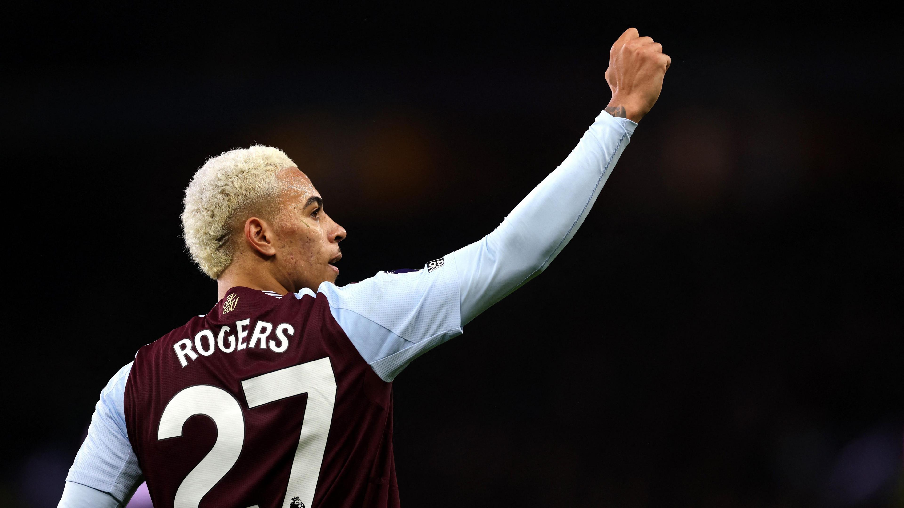 Aston Villa forward Morgan Rogers raises a fist in celebration