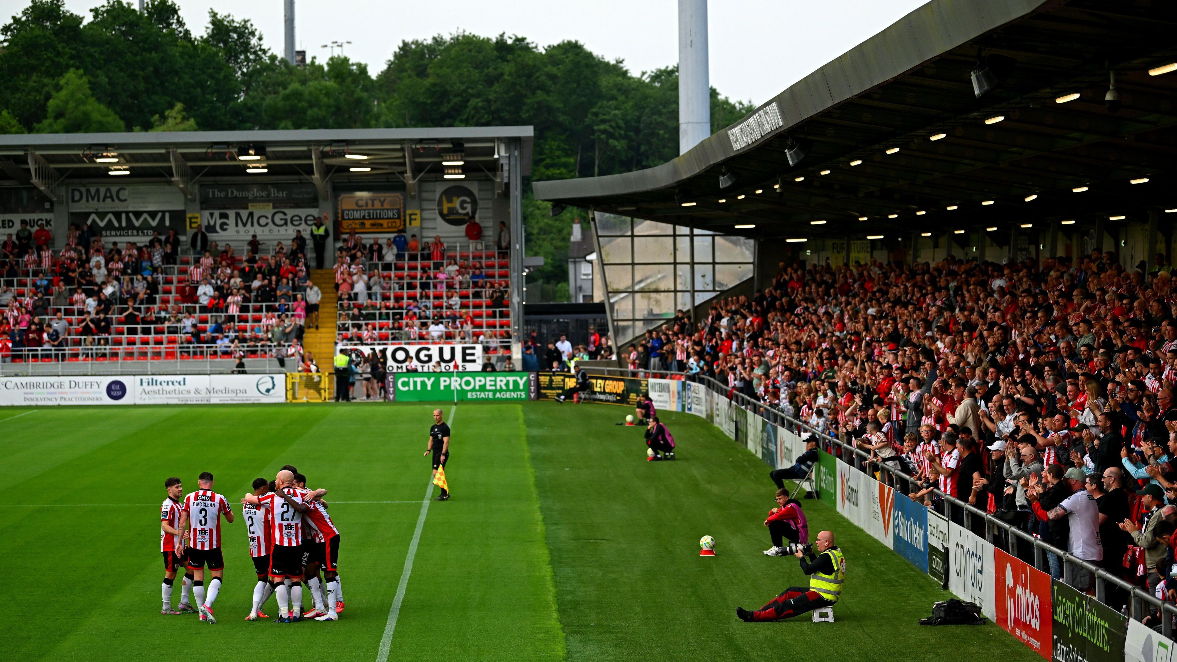Players celebrate Cameron Dummigan's goal