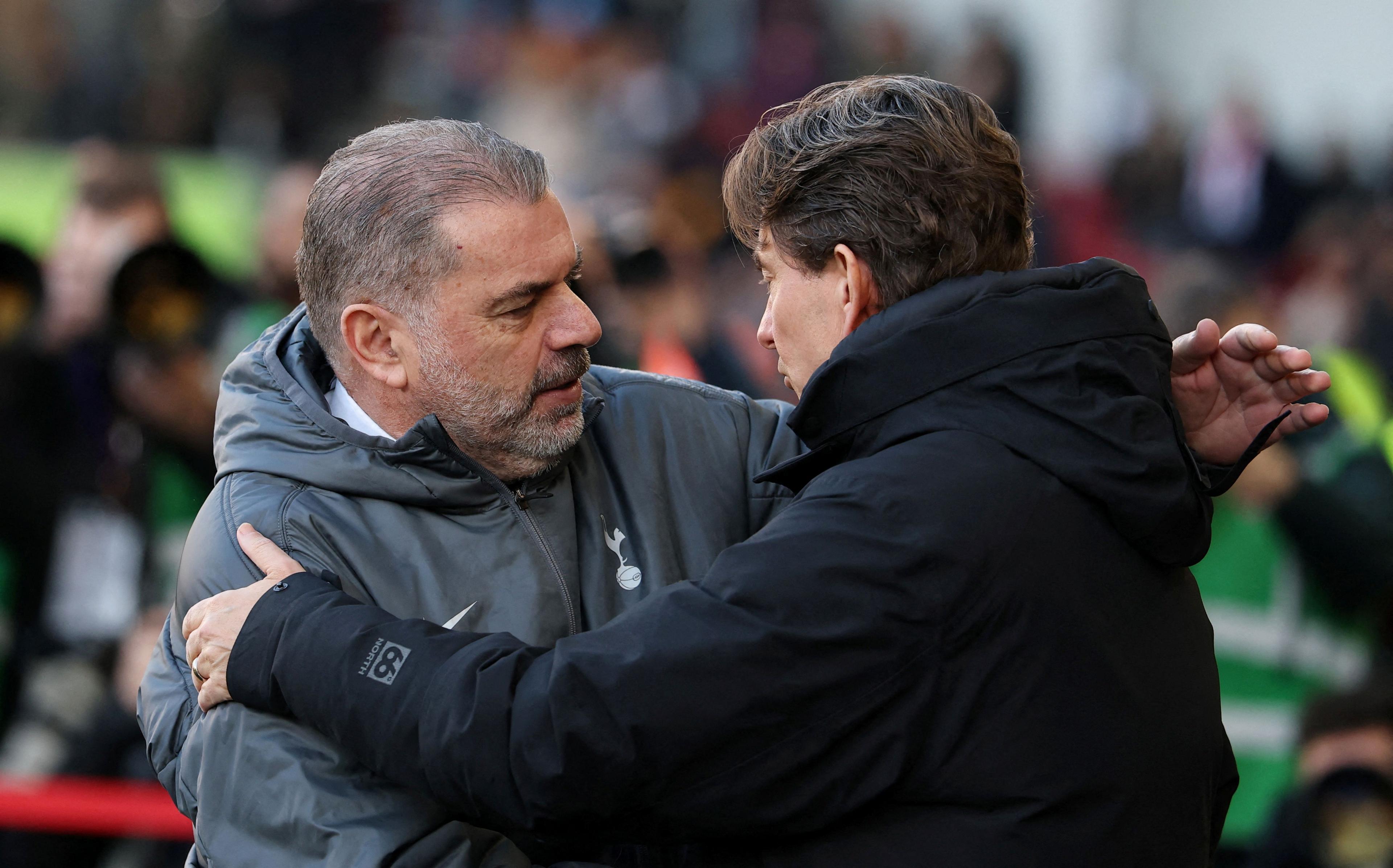 Ange Postecoglou shakes hands with Thomas Frank