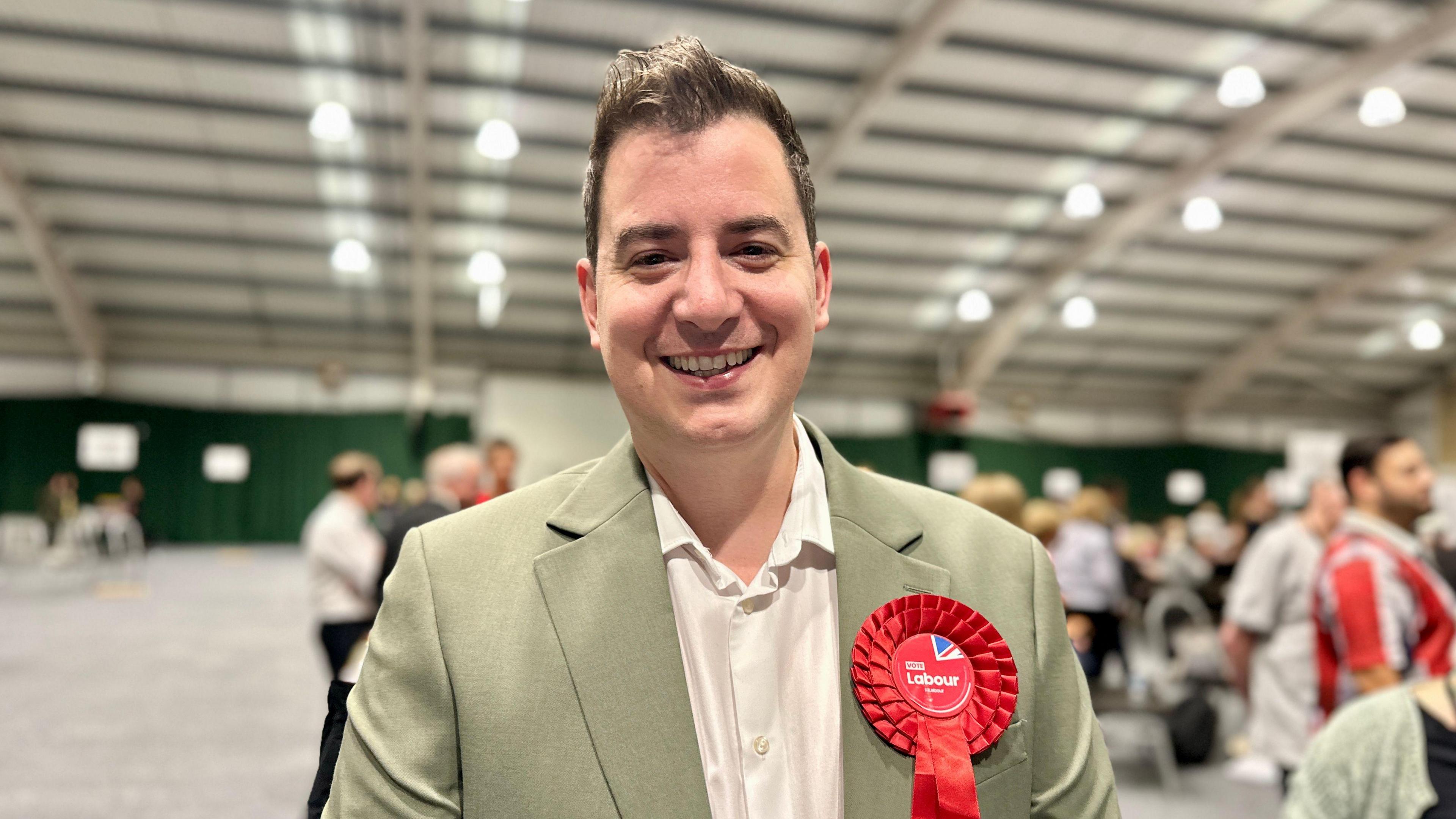 Mike Reader smiling for the camera at the count 