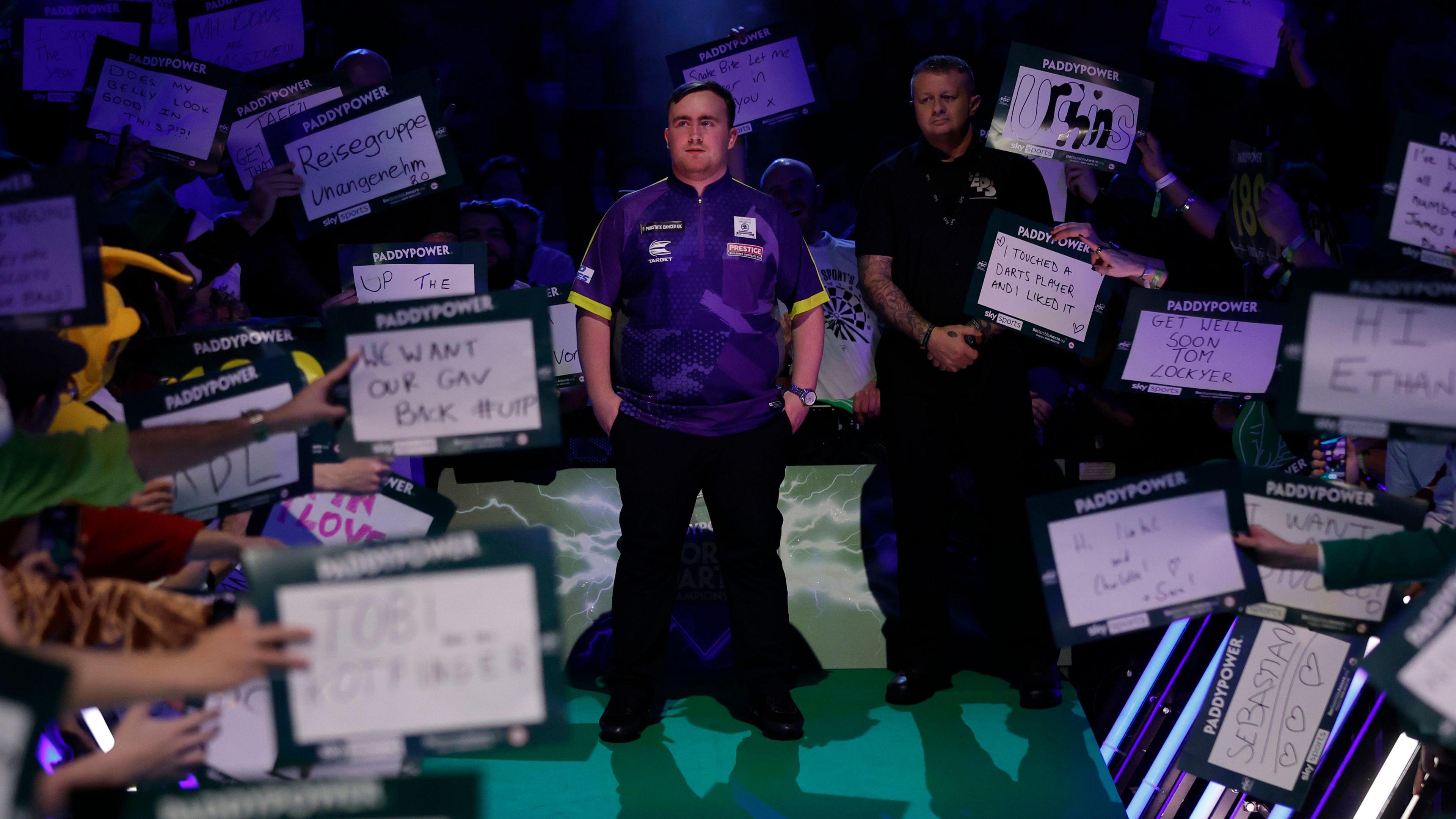 Luke Littler at the end of the runway about to start his walk on before his victory over Christian Kist of Holland in the first round of the 2023-24 PDC World Darts Championship at Alexandra Palace
