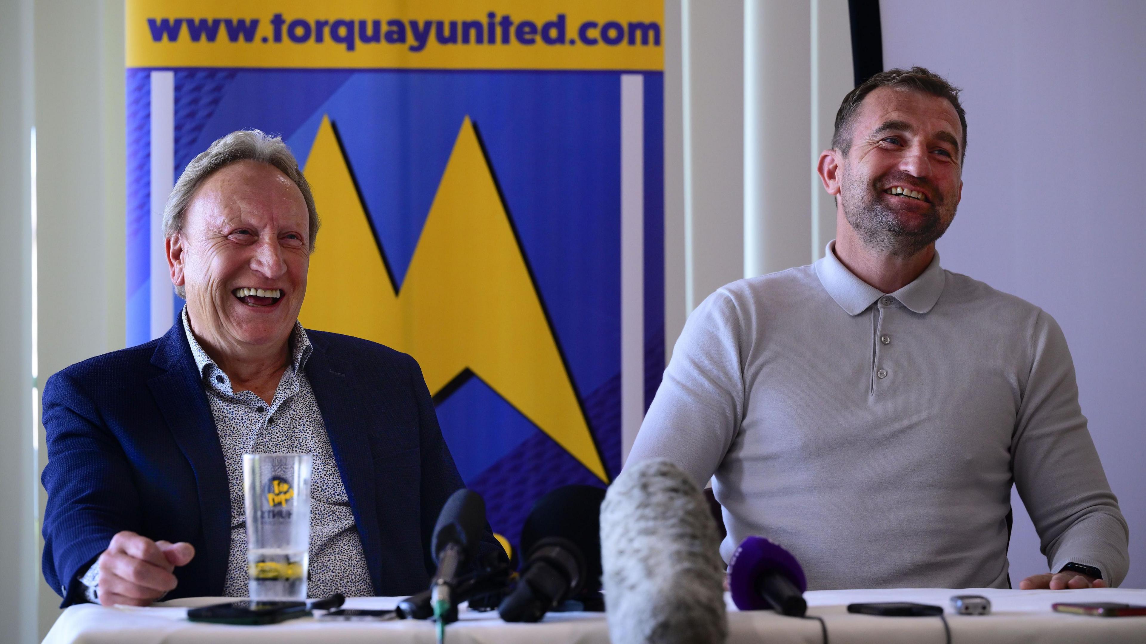 Neil Warnock and Paul Wotton laugh at a joke