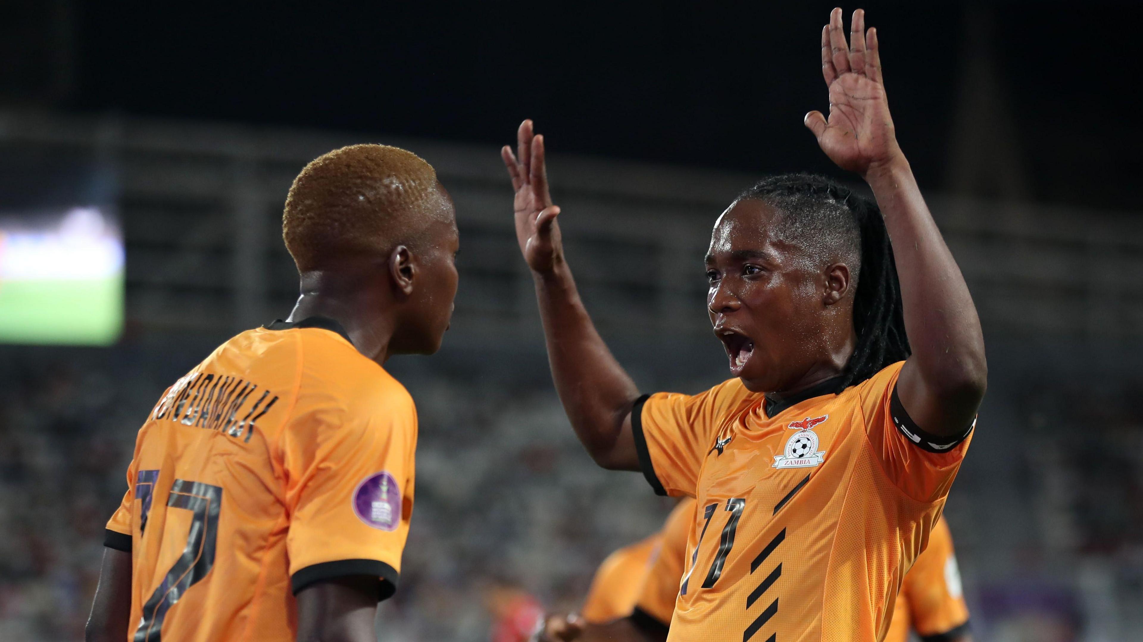 Racheal Kundananji and Barbra Banda celebrate a goal at the Women's Africa Cup of Nations finals