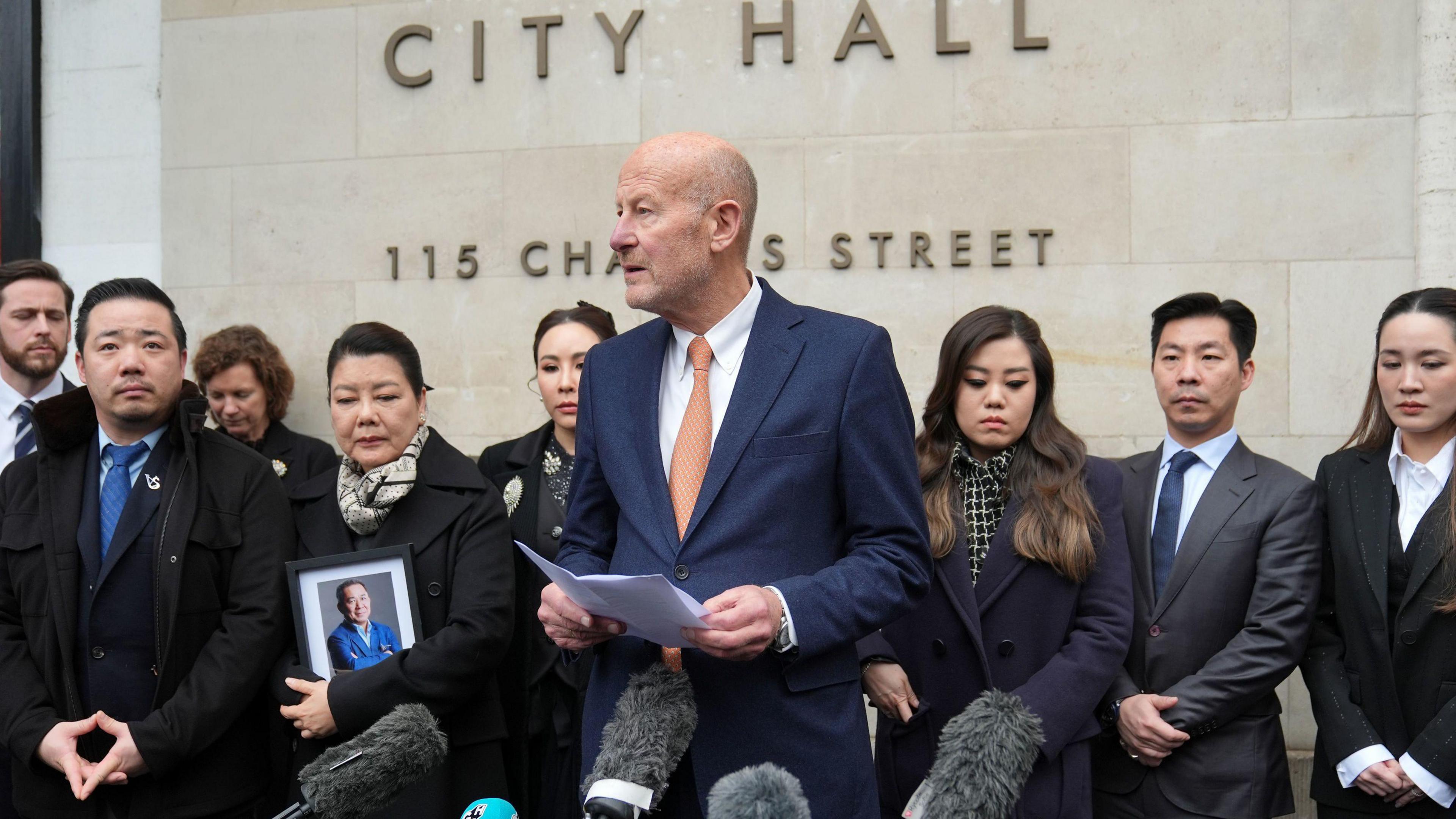 Philip Shepherd KC speaking in front of the family of Vichai Srivaddhanaprabha