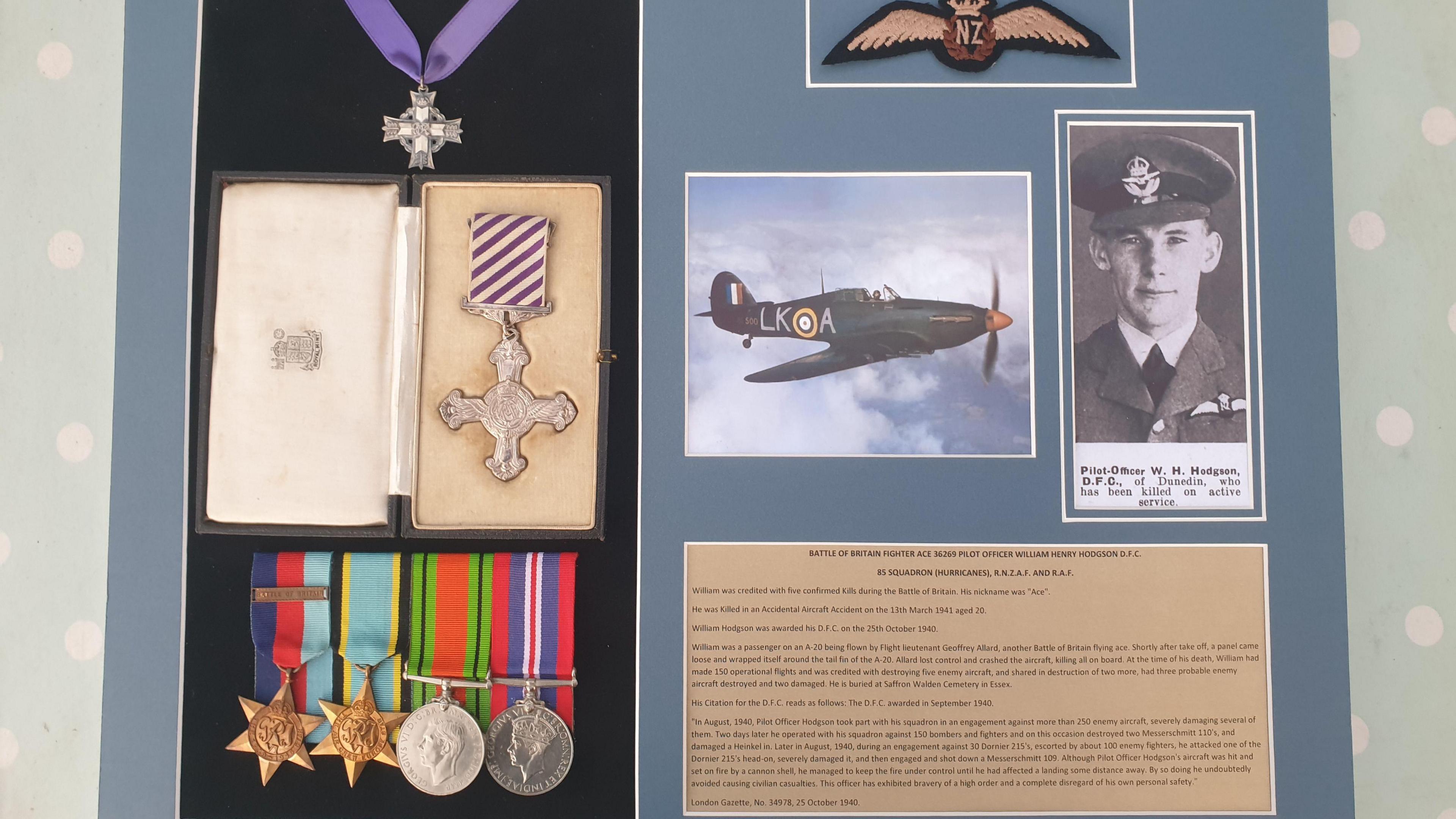 A Battle of Britain medal set on display. There is a black and white photograph of a New Zealander pilot.