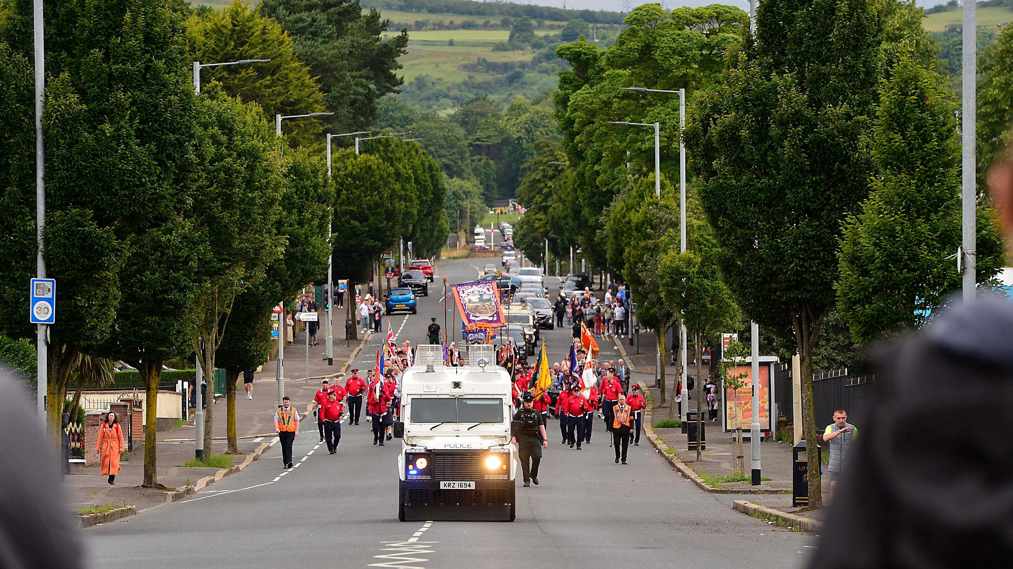 A band passes the Ardoyne shops 