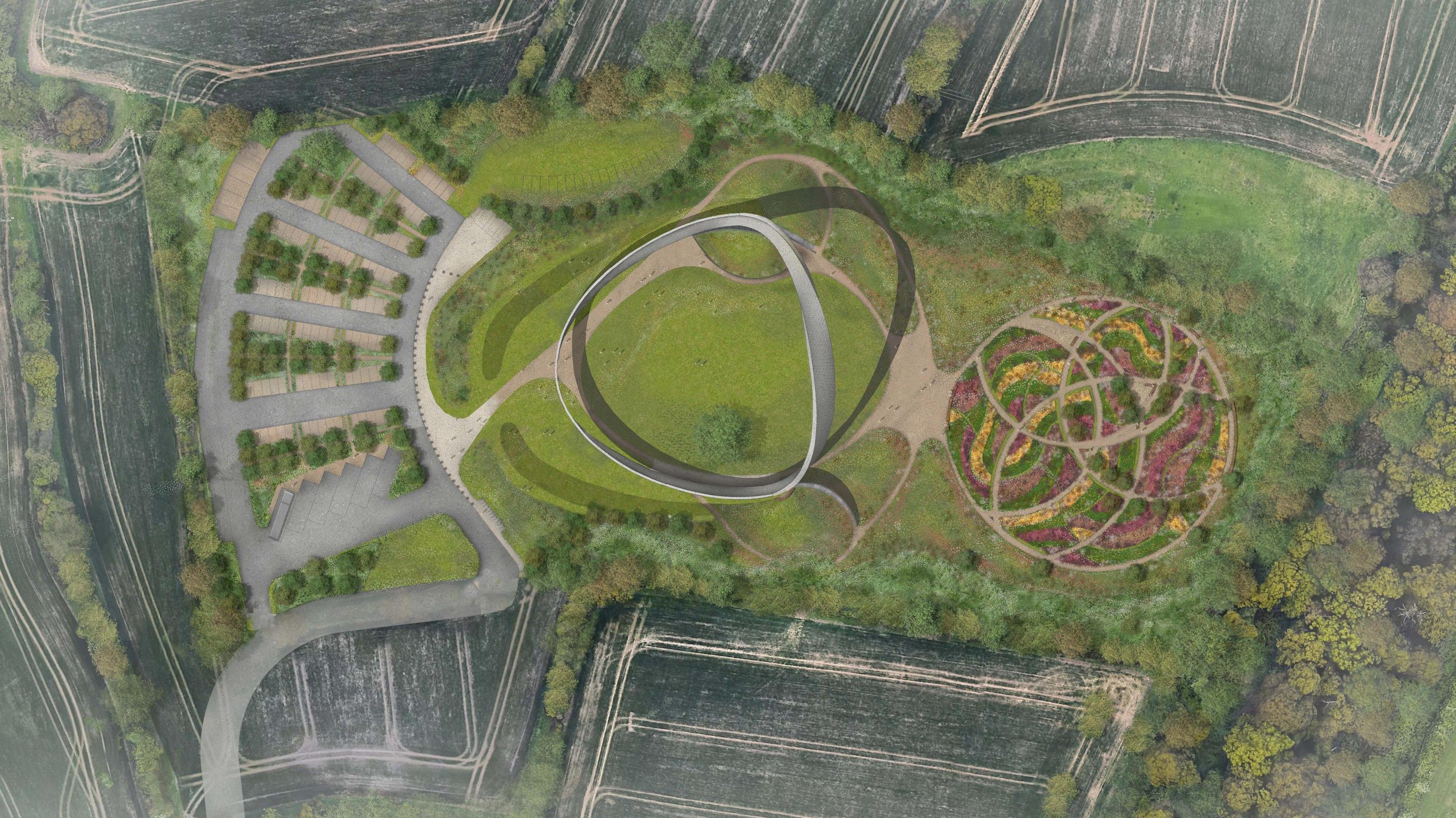 A computer generated image showing an aerial view of a large circular monument next to a car park with roads weaving around it. A large garden of flowers can be seen to the right of it, with trees alongside.