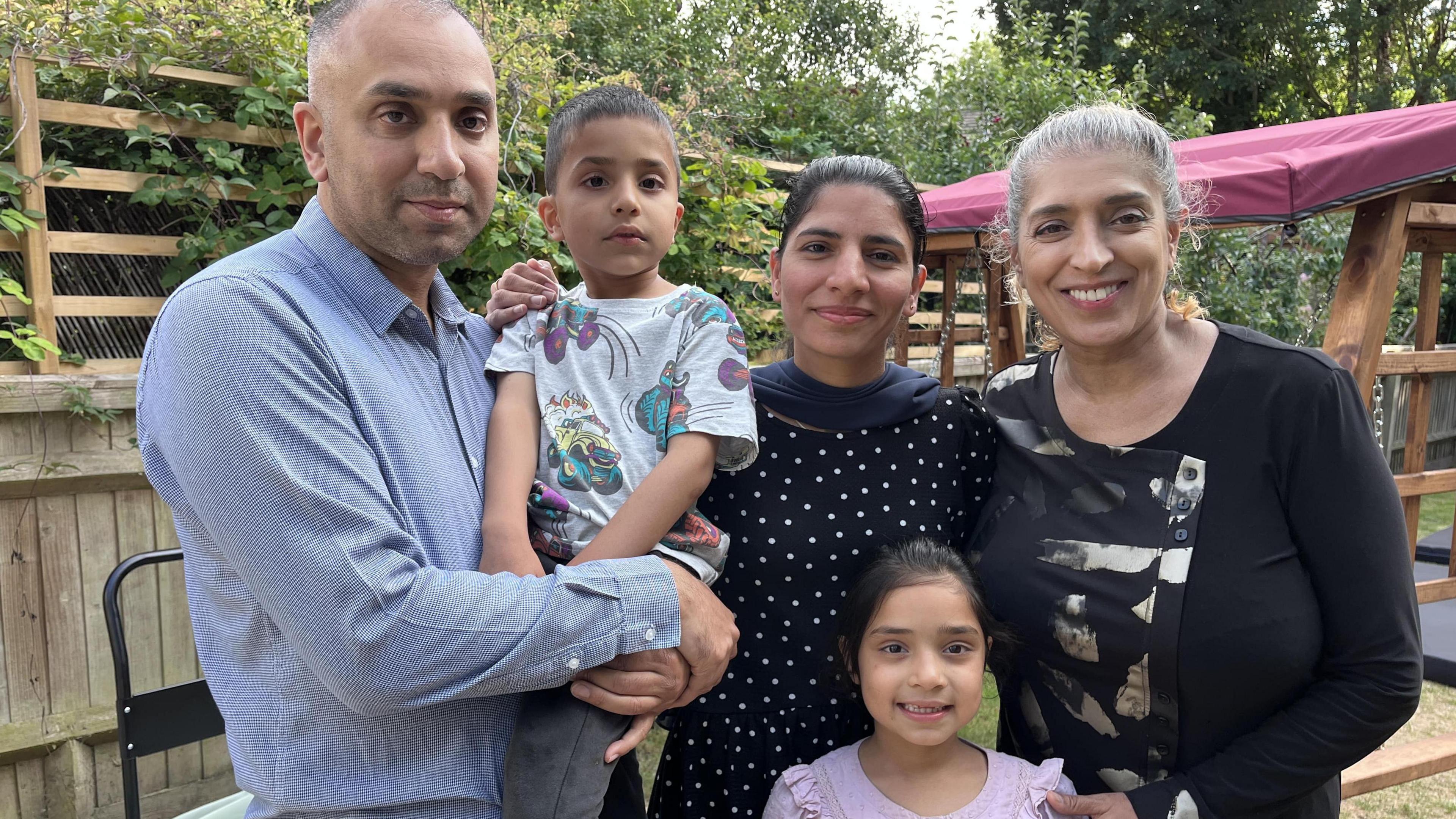 Idrees at home with his dad Qasim, mum Sadia, sister Eliza and grandma Nasreen