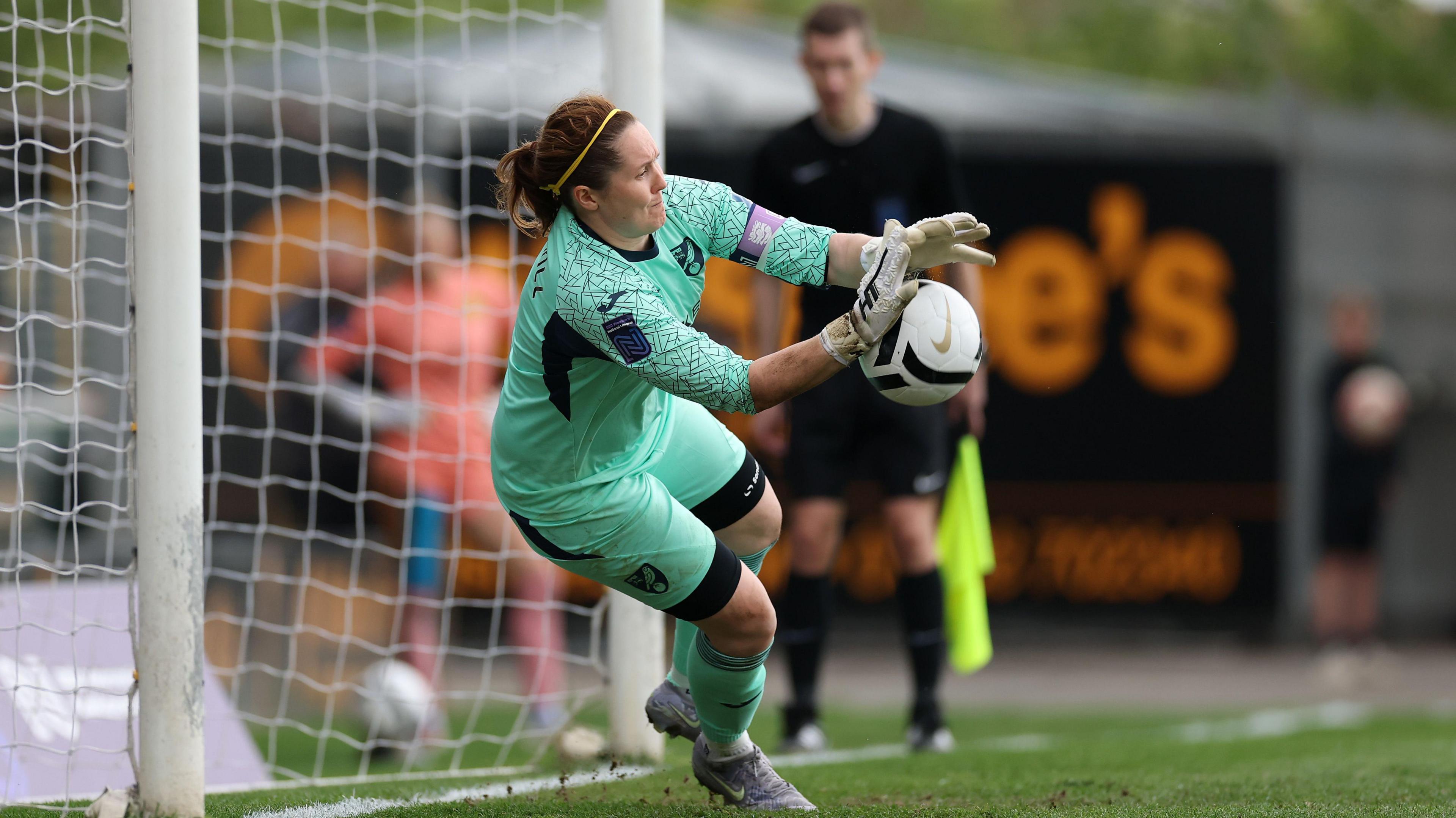 Norwich goalkeeper Sarah Quantrill makes a save in the penalty shootout
