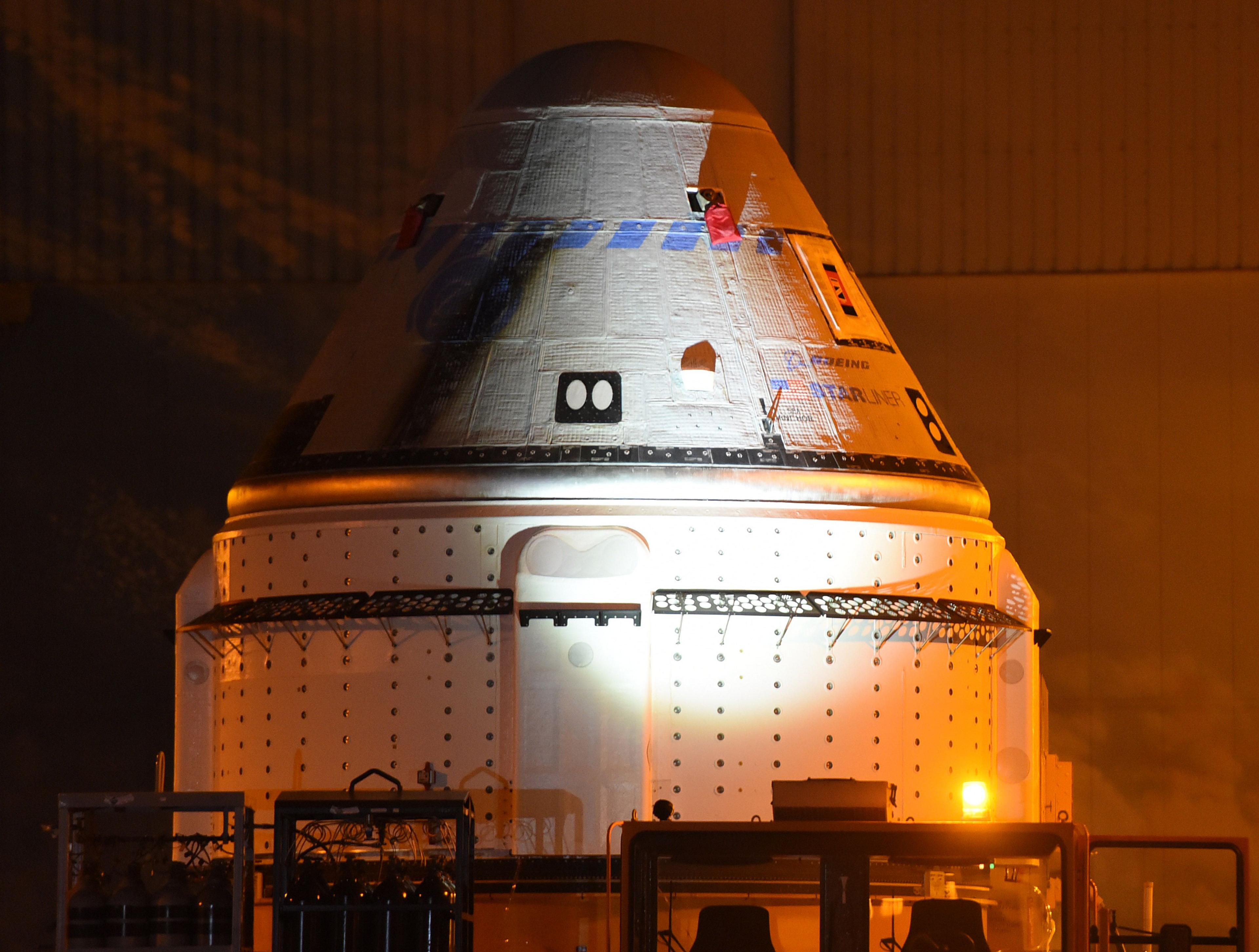 The 100 Starliner spacecraft rolls out of the Commercial Crew and Cargo Processing Facility at the Kennedy Space Center.