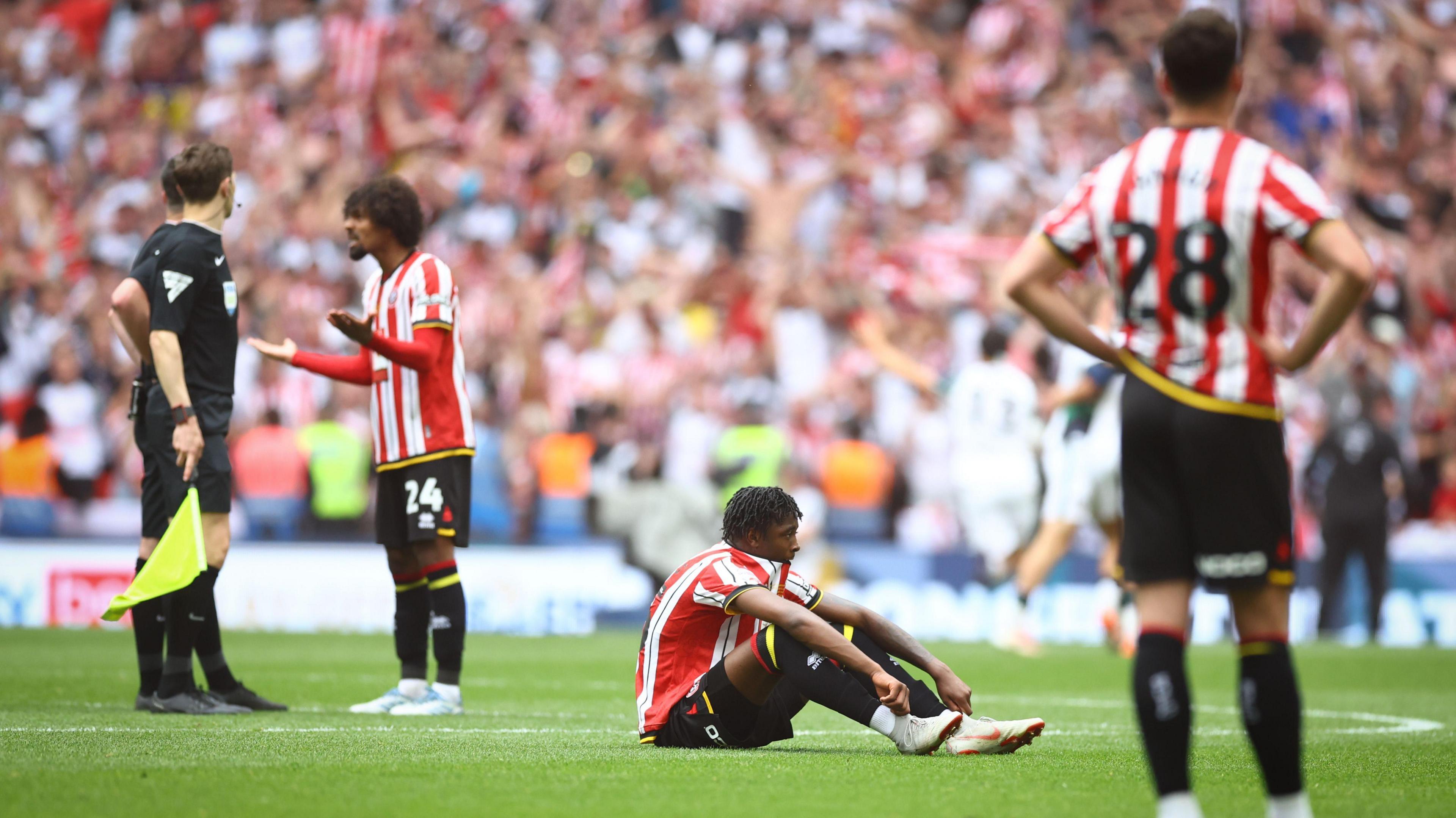 Sheffield United players look dejected after losing the play-off final