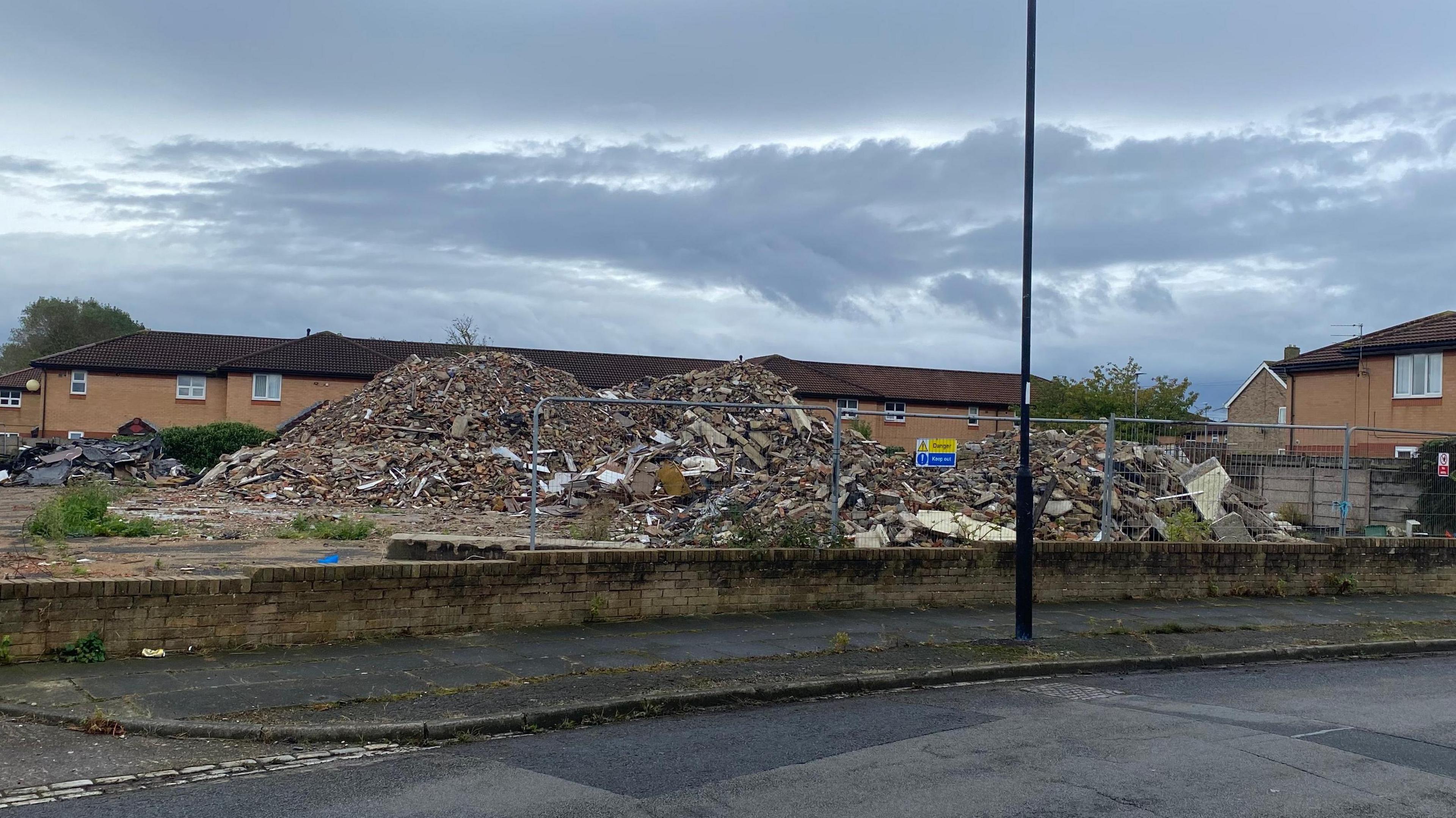 A huge pile of rubble where the former Hourglass pub has been demolished