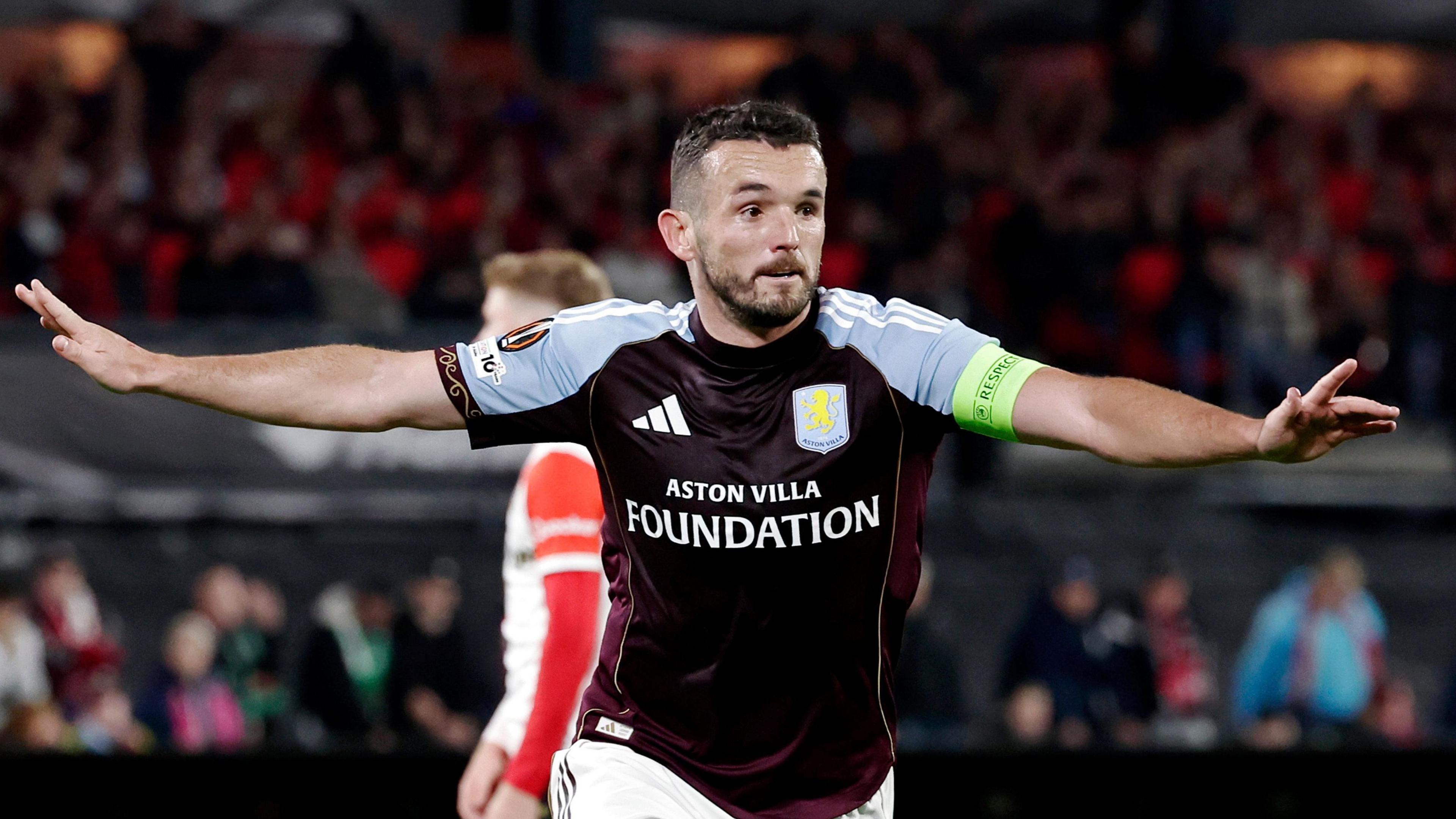 John McGinn celebrates scoring for Aston Villa against Feyenoord in the Europa League