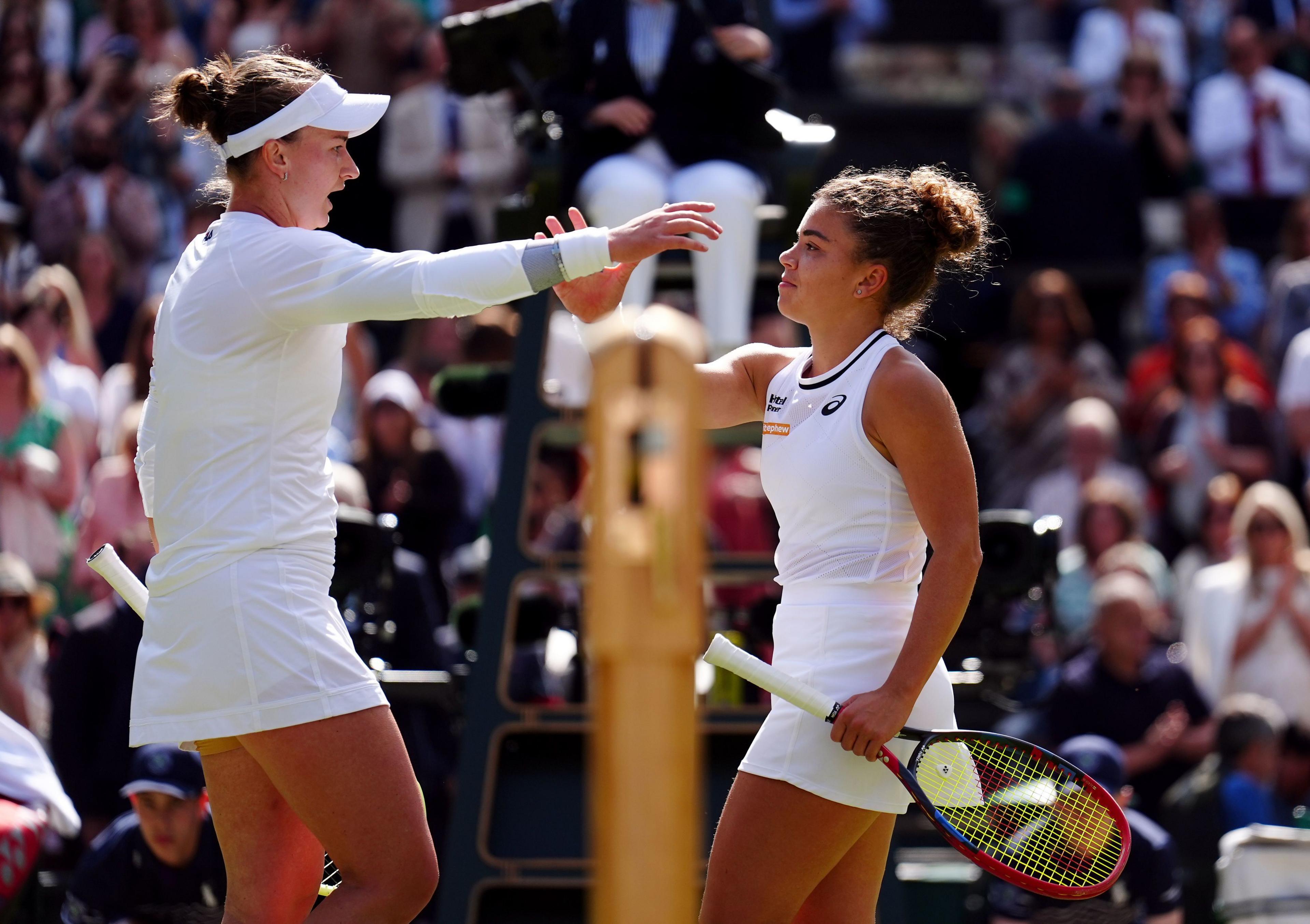 Barbora Krejcikova and Jasmine Paolini meet at the tennis net