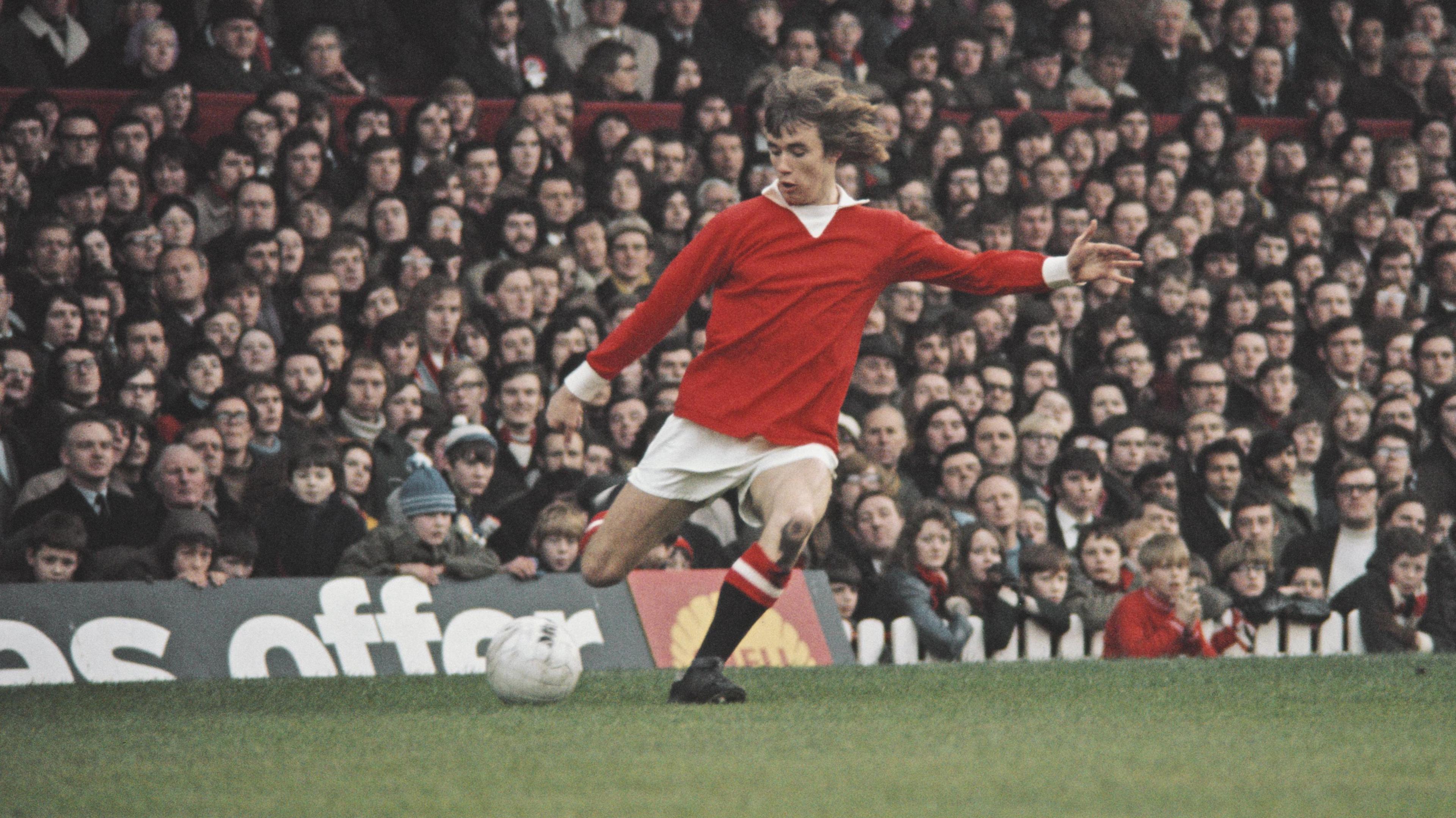 A teenage Sammy McIlroy in action for Manchester United