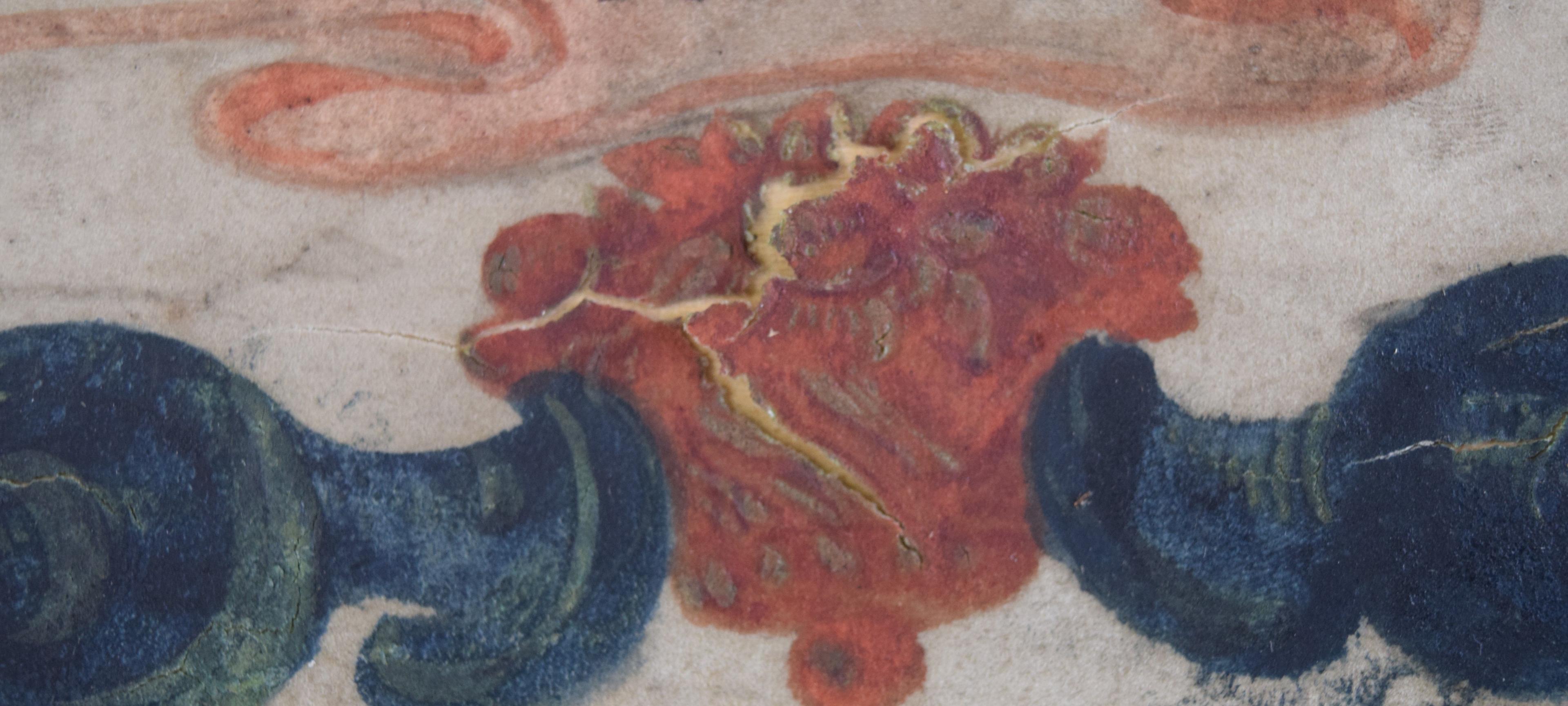 Close up of map showing blue shapes either side with a red shape in middle, which has a line through it to indicate damage to the parchment.