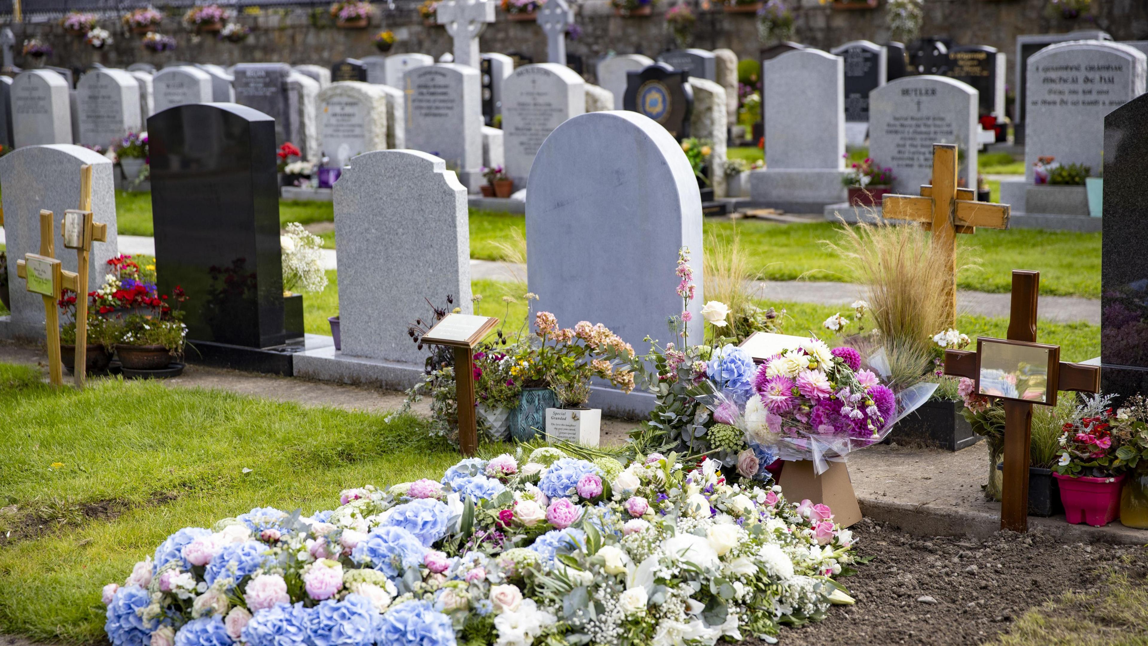 Flowers at the grave of Sinead O'Connor in The Garden section of Deansgrange Cemetery, Dublin