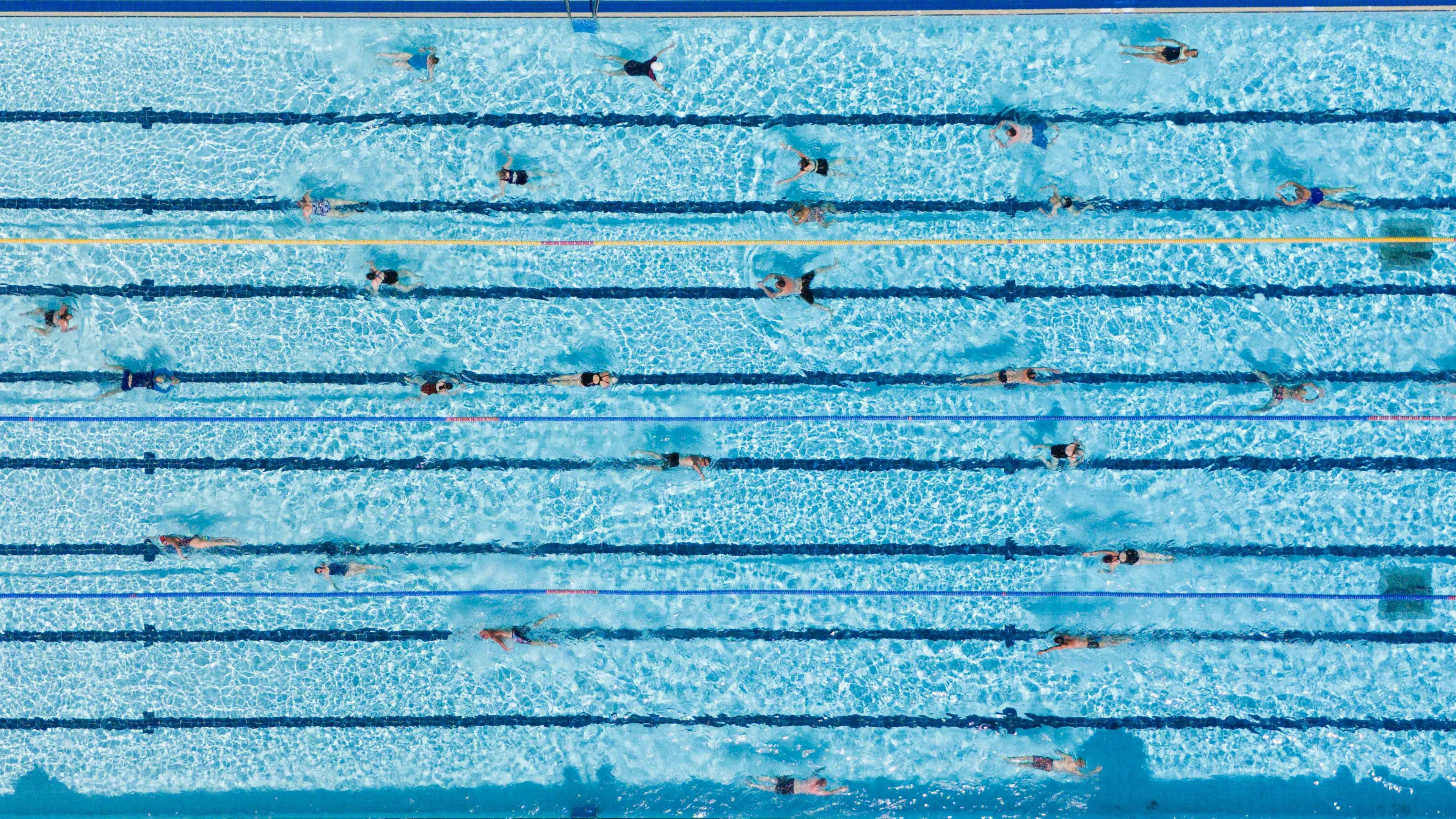 People swim at Banbury Lido at Woodgreen Leisure Centre in Oxfordshire.