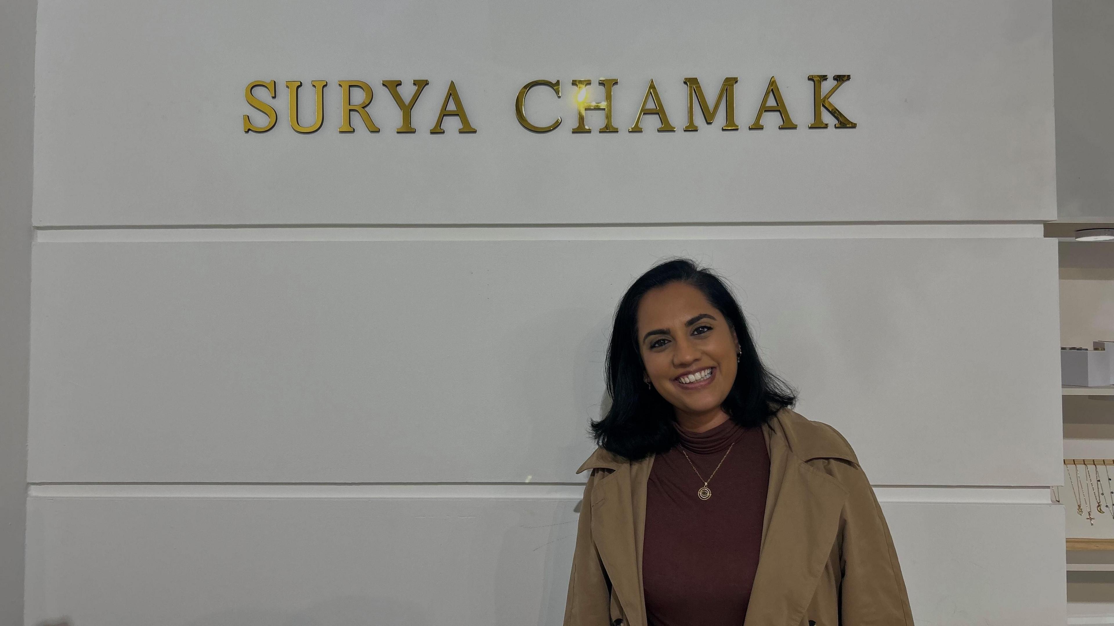 Reena Gohil-Khetani stood in front of her shop's branding