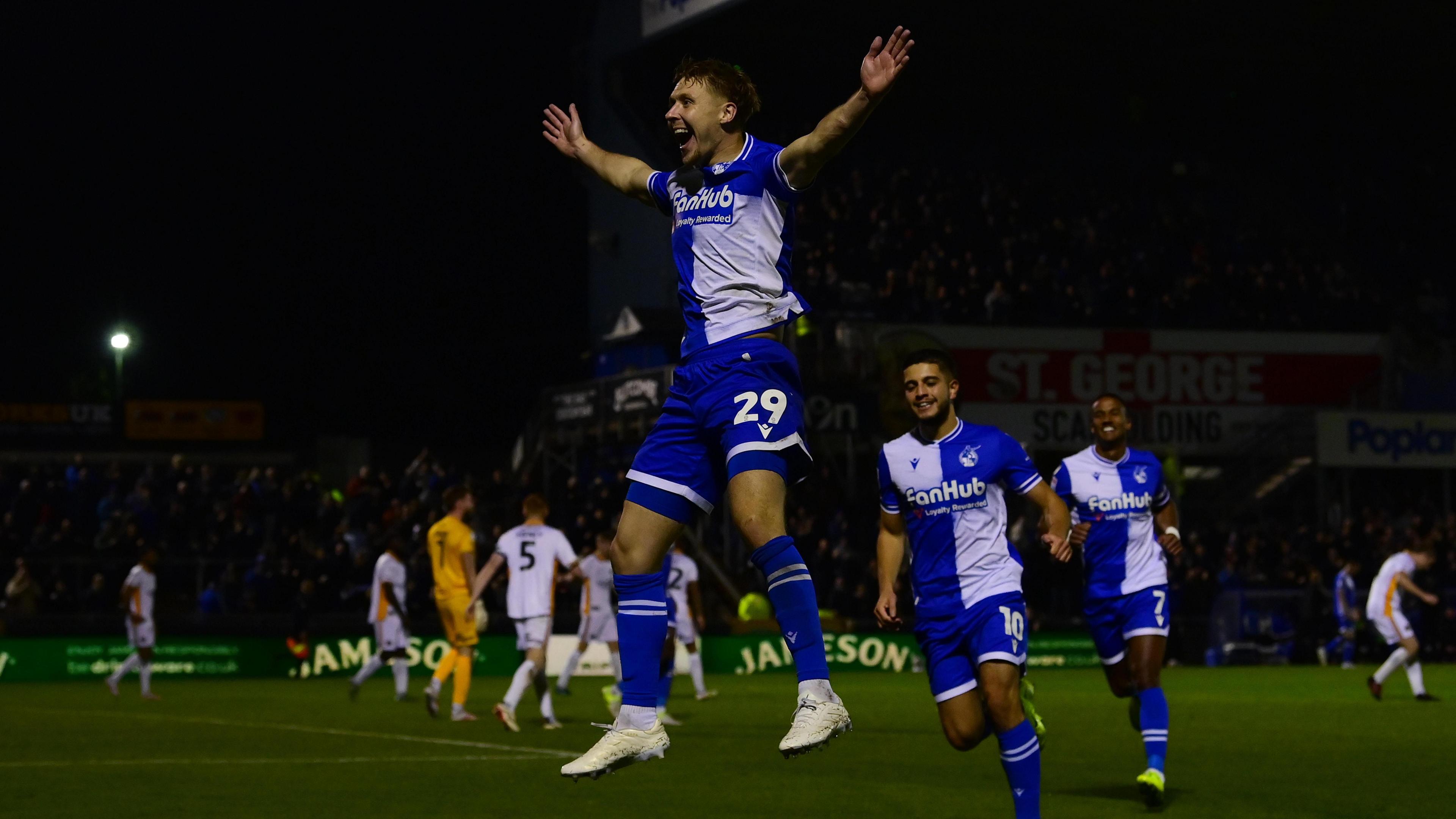 Jamie Lindsay jumps in the air in celebration after goal