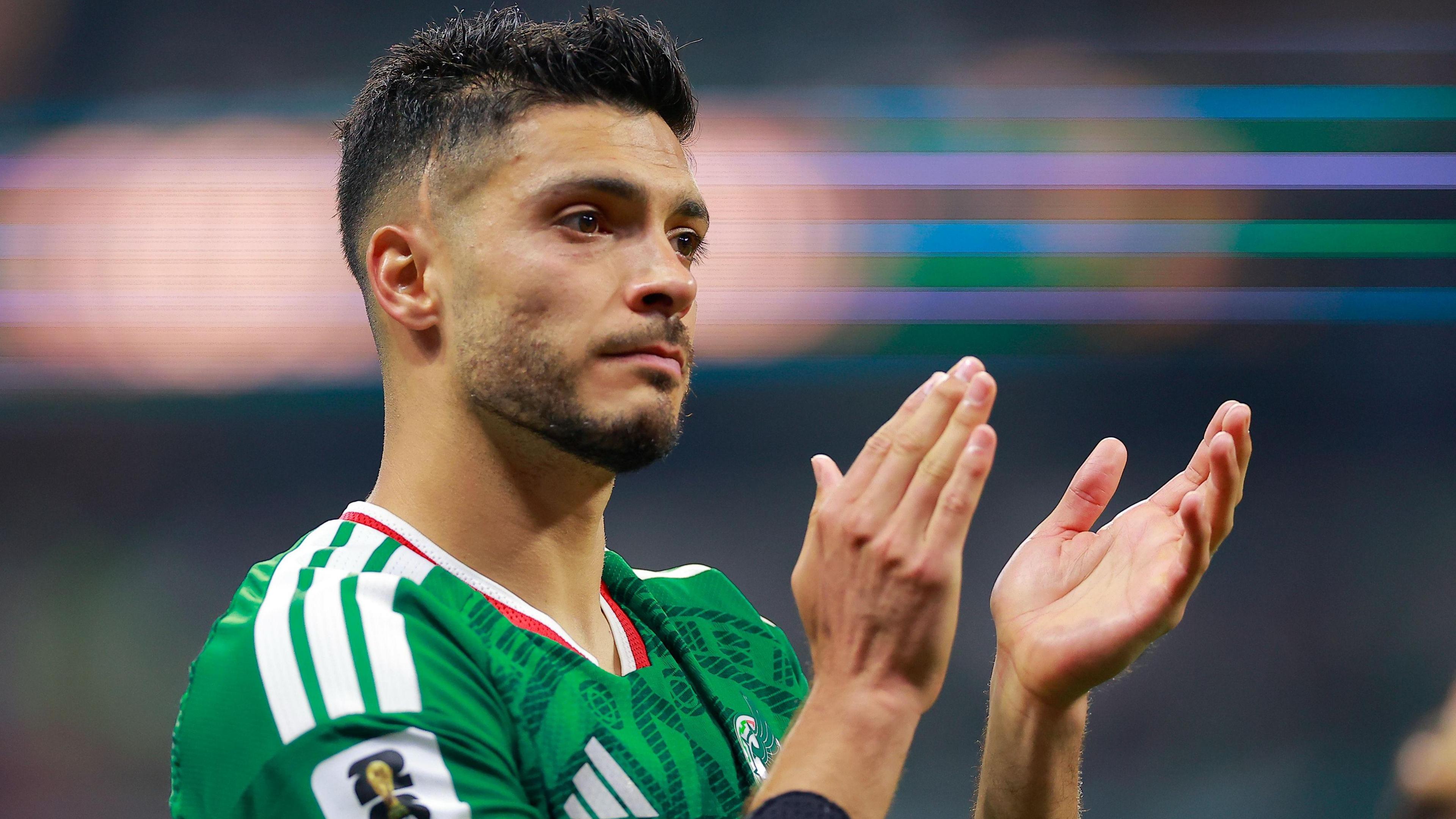 Raul Jimenez, wearing Mexico's green shirt with white Adidas stripes and a white and red collar, looks dejected as he claps his hands after Mexico's 3-2 defeat to England in the last-16 of the World Cup