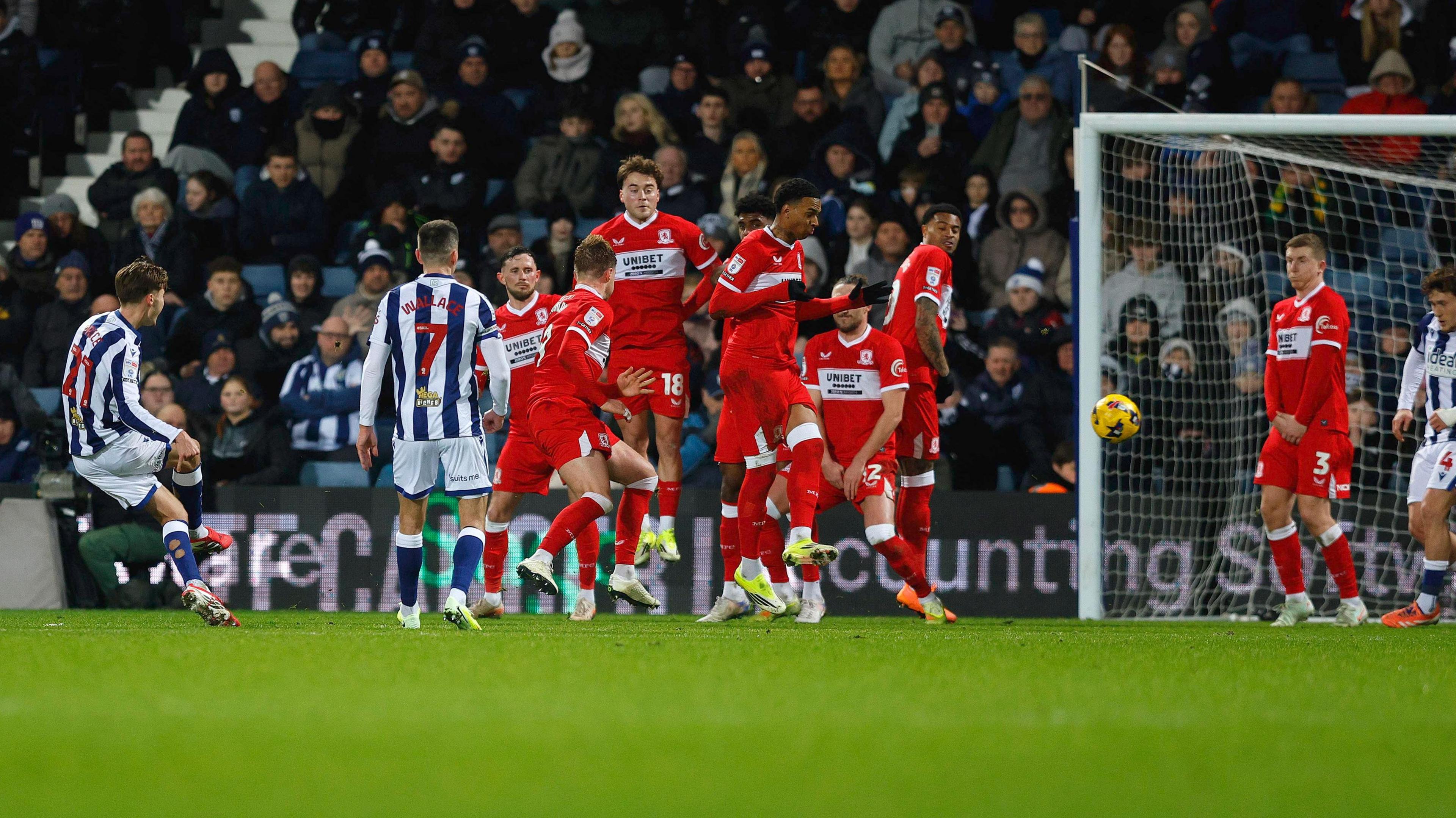 Isaac Price curls in a free-kick beyond the Middlesbrough wall