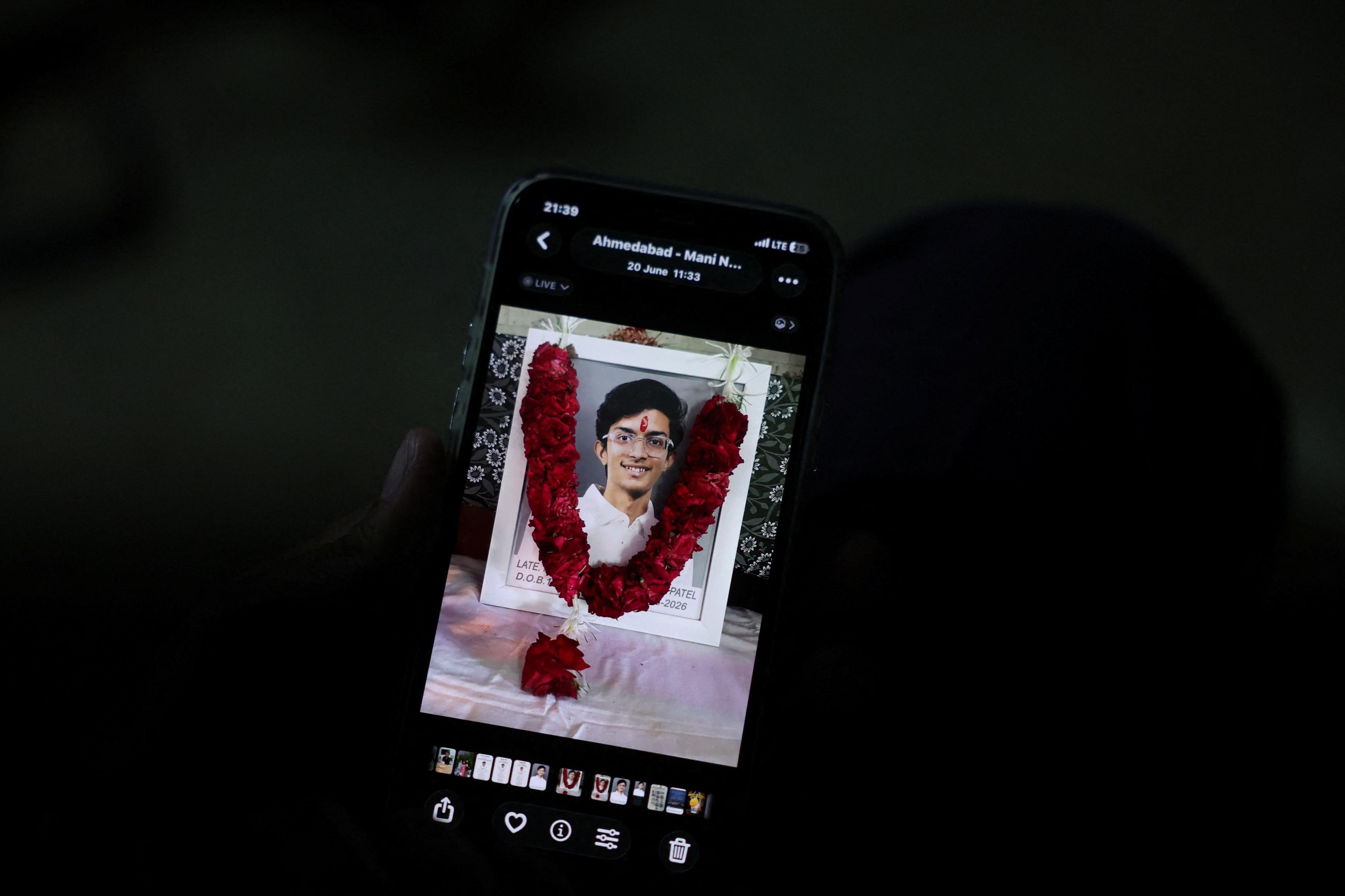 Prashant Patel, 45, shows a photo of his 17-year-old son Kahaan Patel, who took his own life ahead of the NEET exam retest, in Ahmedabad, India, July 21, 2026. REUTERS/Amit Dave