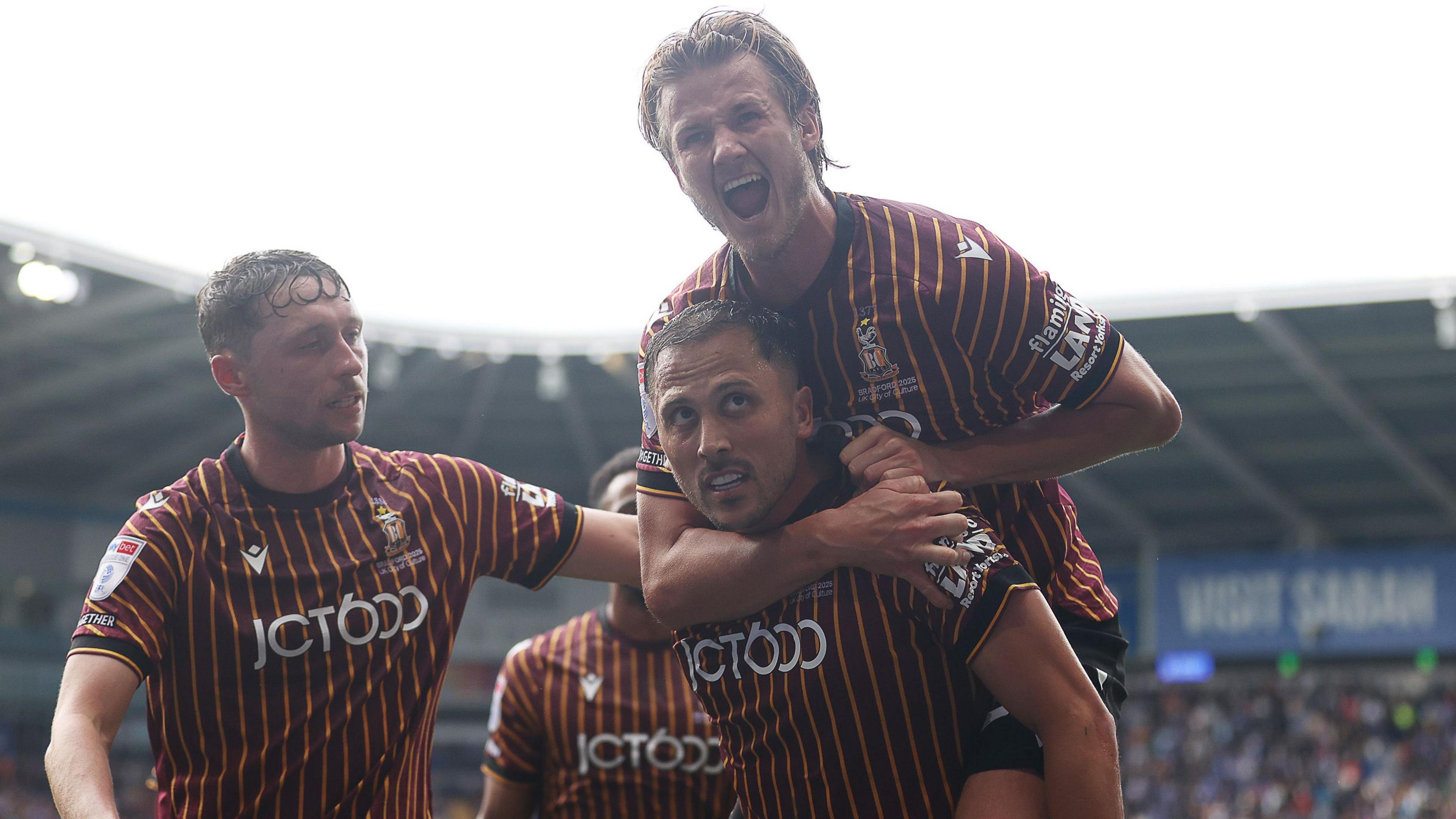 Antoni Sarcevic of Bradford City celebrates scoring a goal with fellow goal scorer Tommy Leigh who is on the back of Sarevic