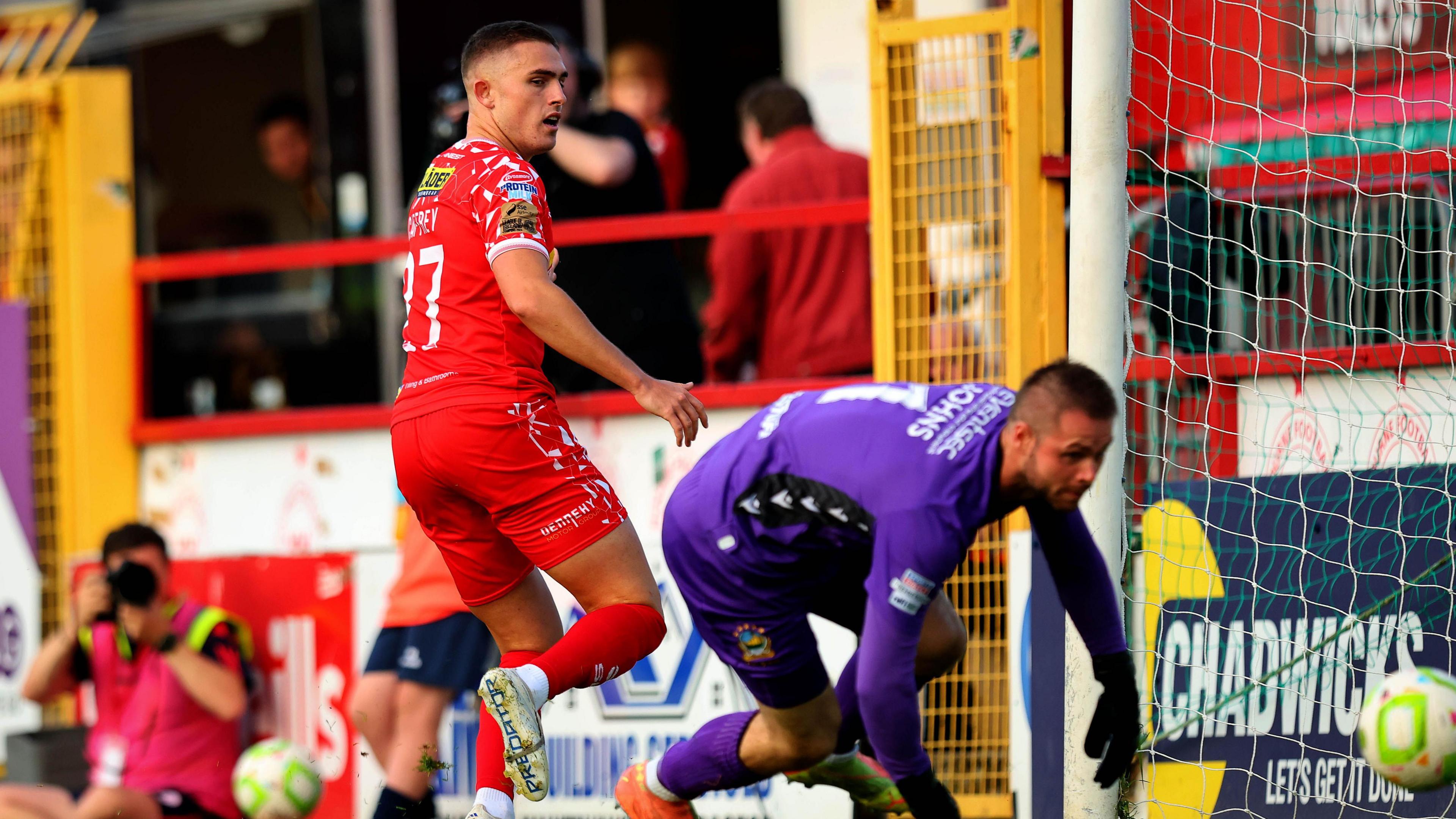 Chris Johns produces a fine save to deny Evan Caffrey
