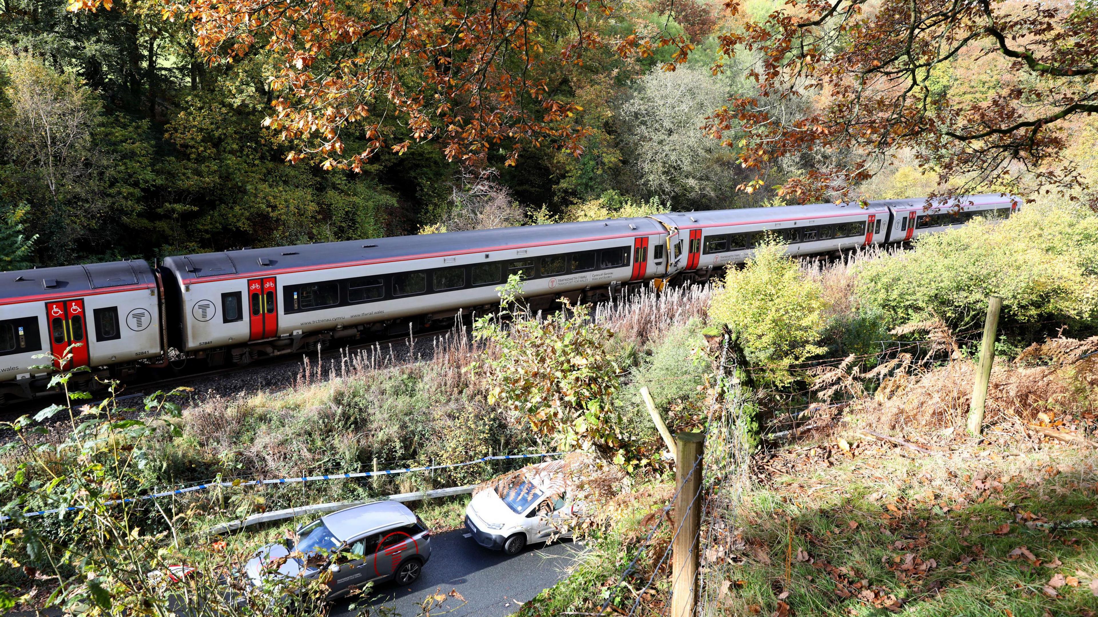 Emergency workers at the scene after a collision involving two trains near Llanbrynmair, mid Wales