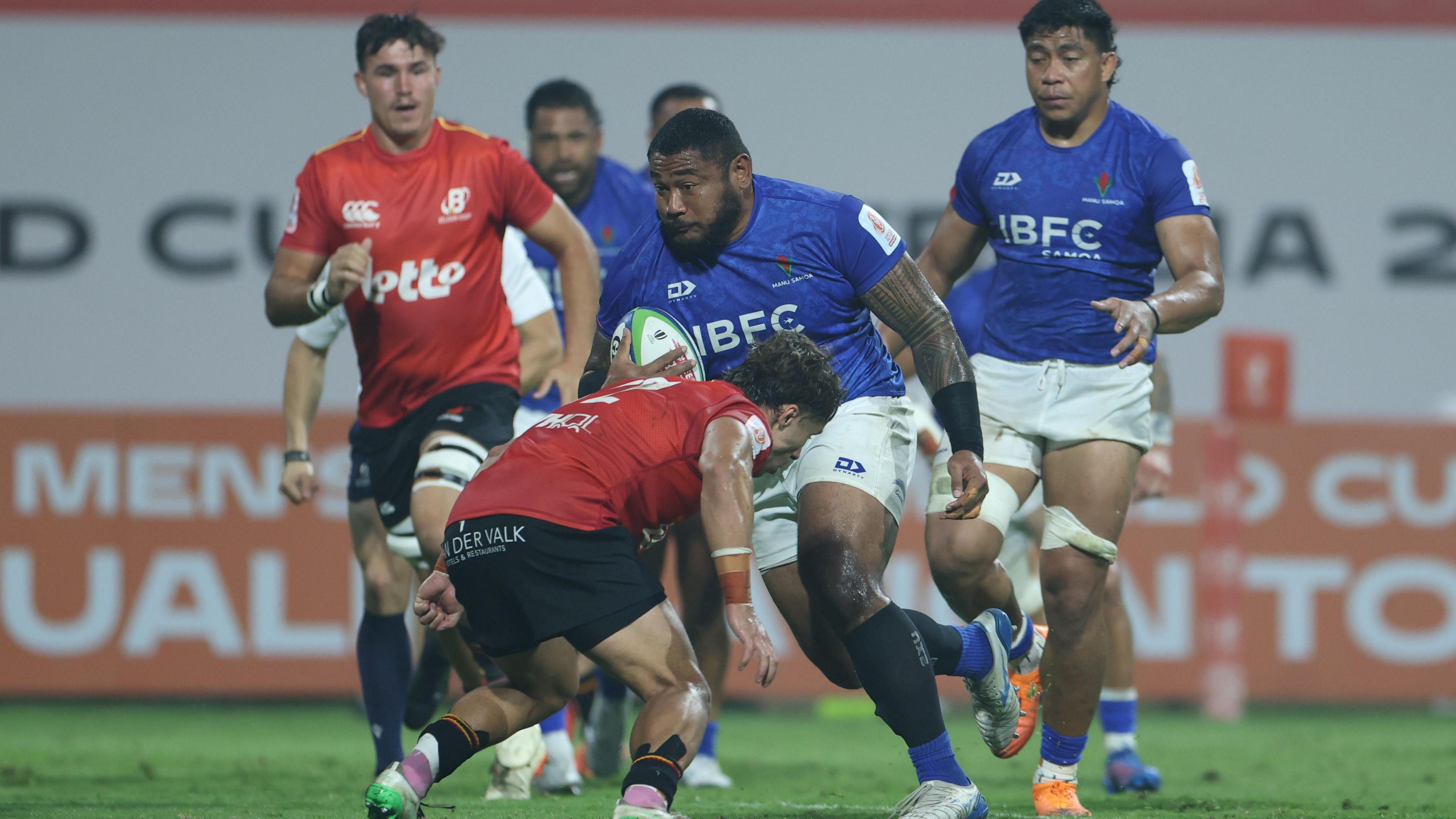 Samoa and Belgium players battle for the ball in Dubai