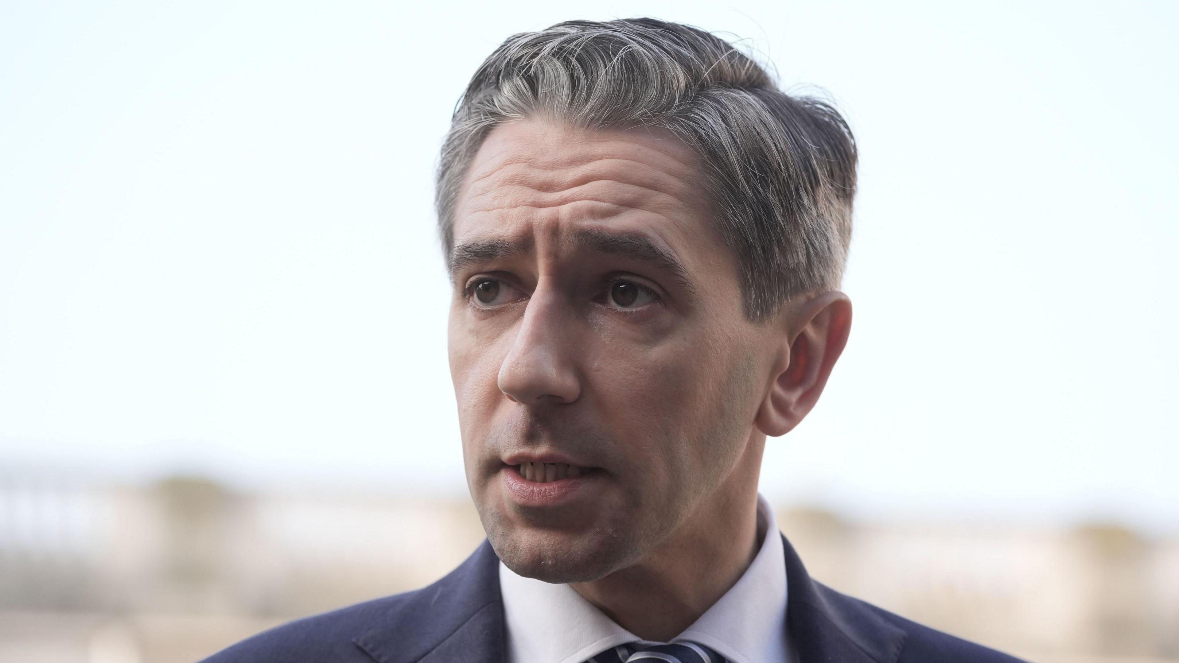 Taoiseach Simon Harris speaking to the media in the courtyard of the Government Buildings, Dublin