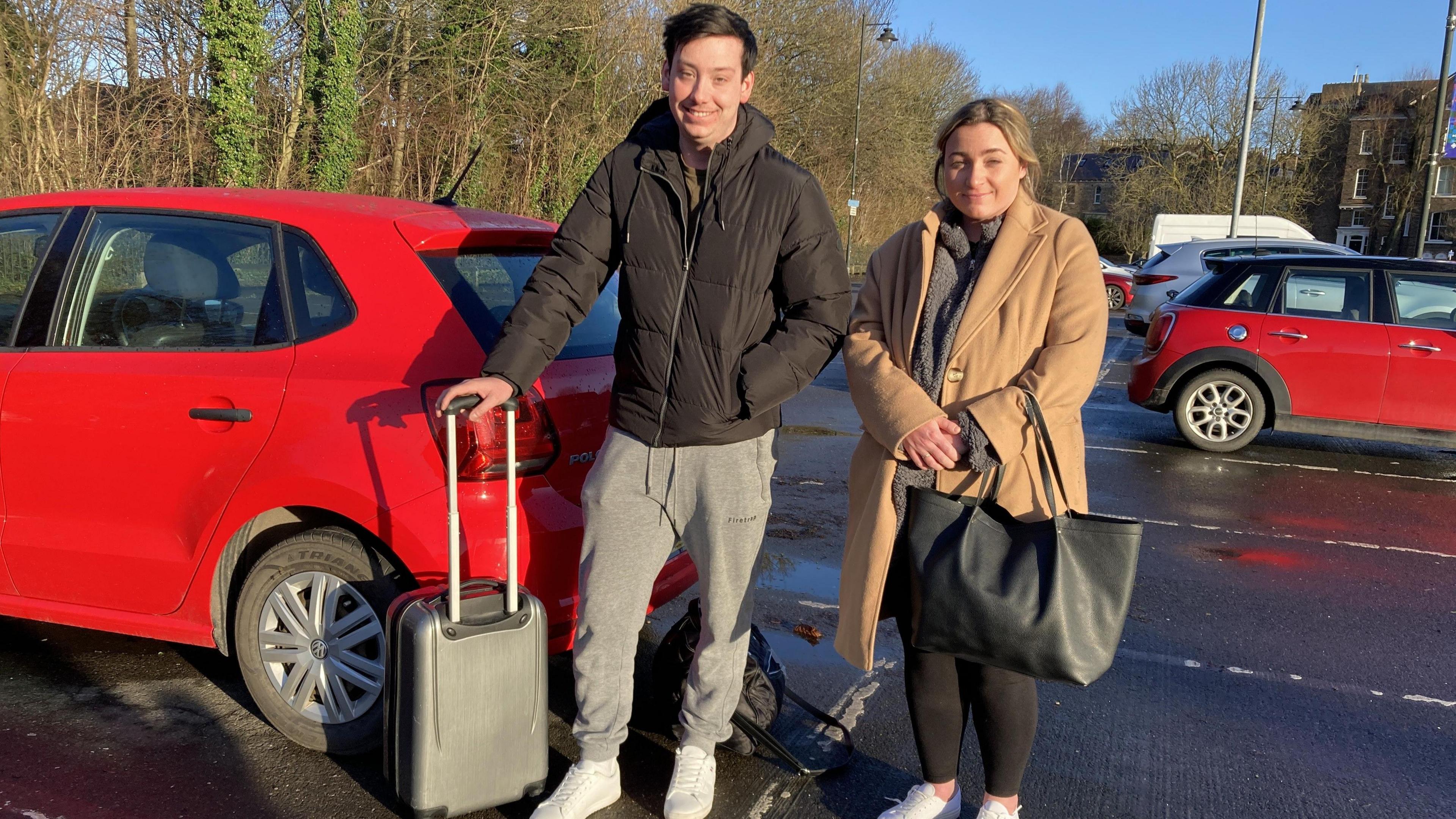 Jordan and Melissa with their suitcase