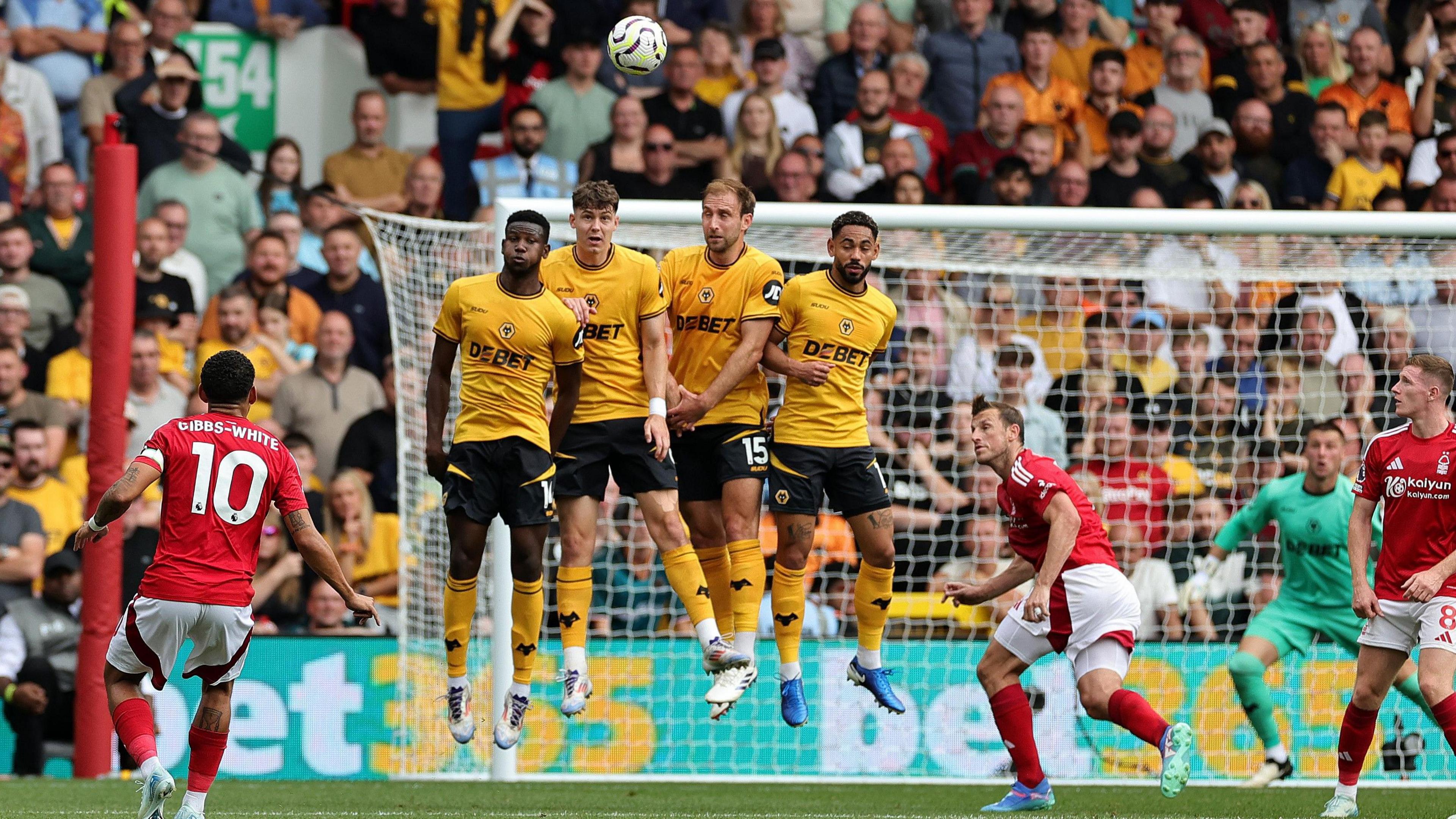 Morgan Gibbs-White takes a free-kick against Wolves.