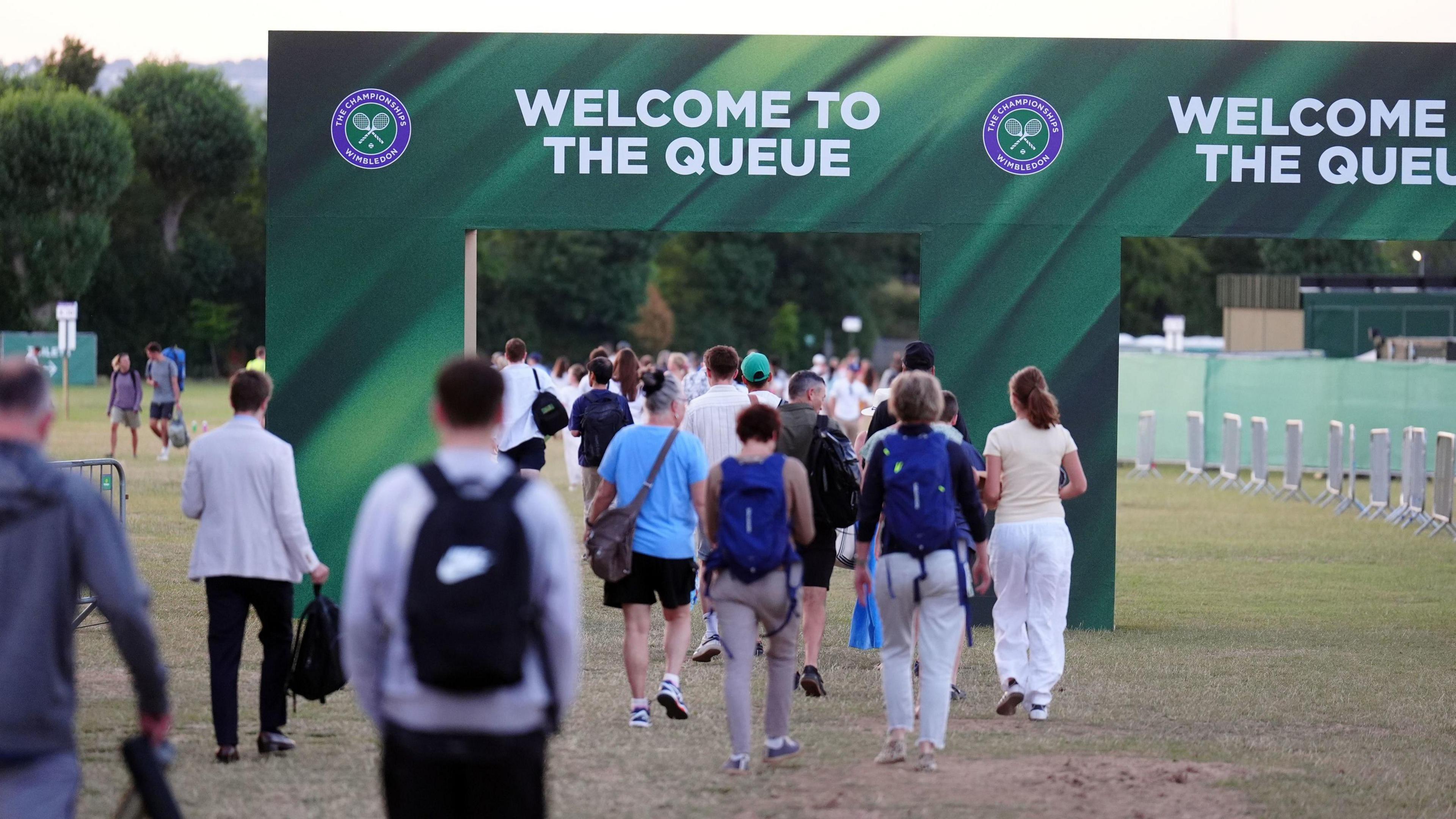 people walking in the queue