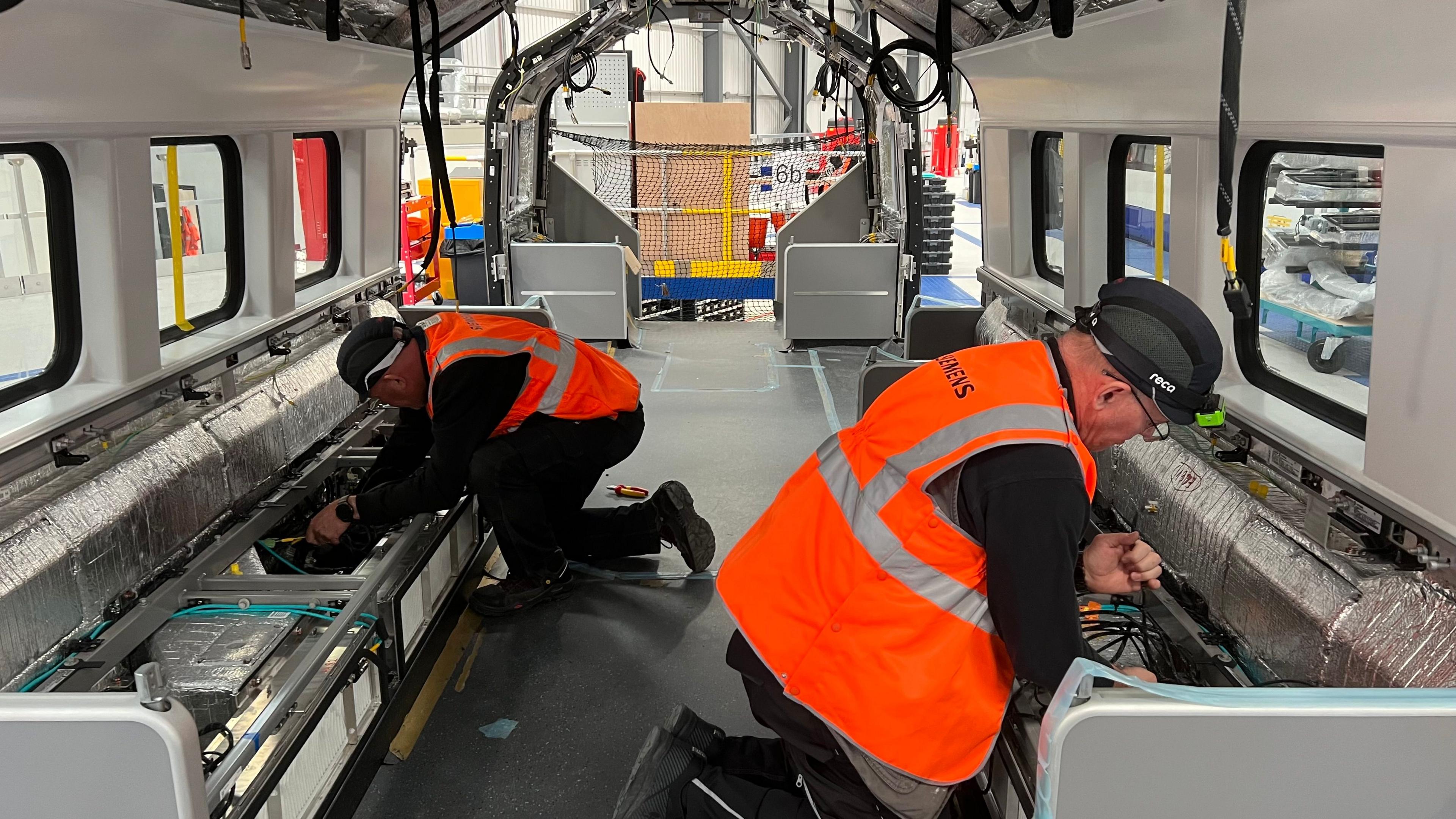 Workers building the new trains 