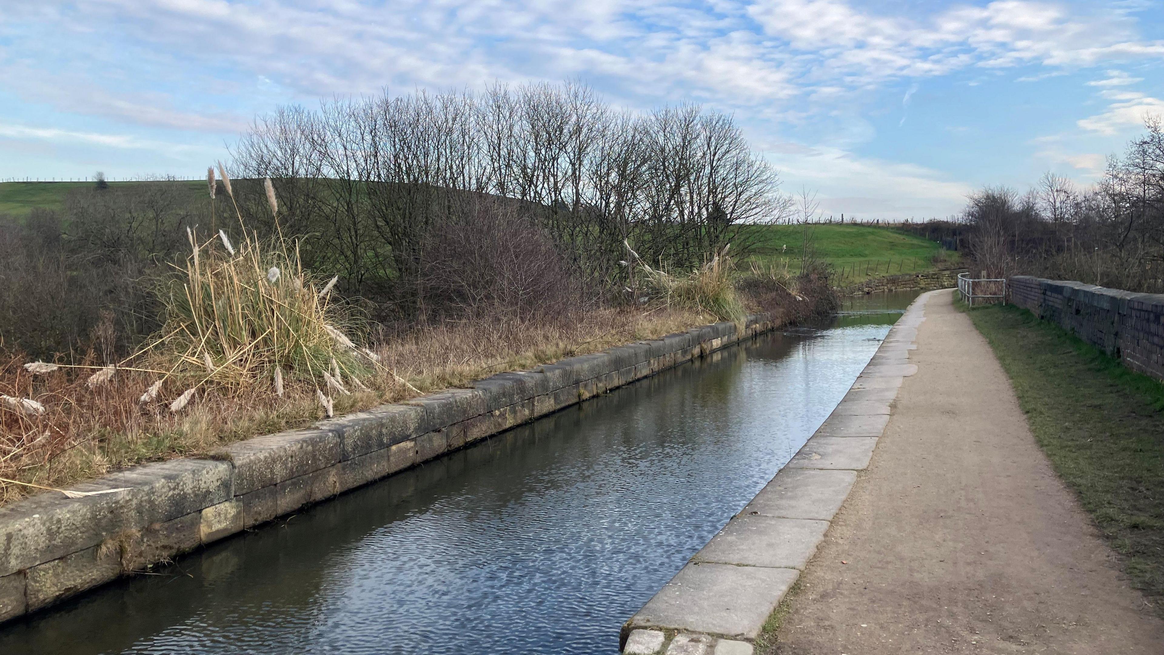 A canal aqueduct runs above the River Irwell in the Prestolee area of Bolton.  