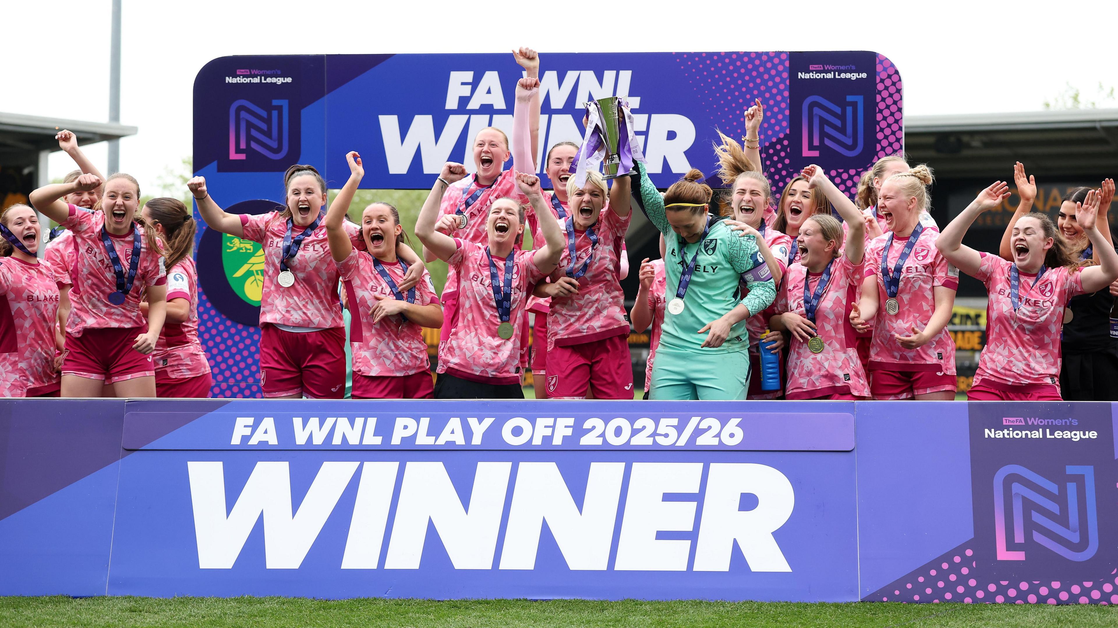 Norwich receive the trophy following their penalty shootout win