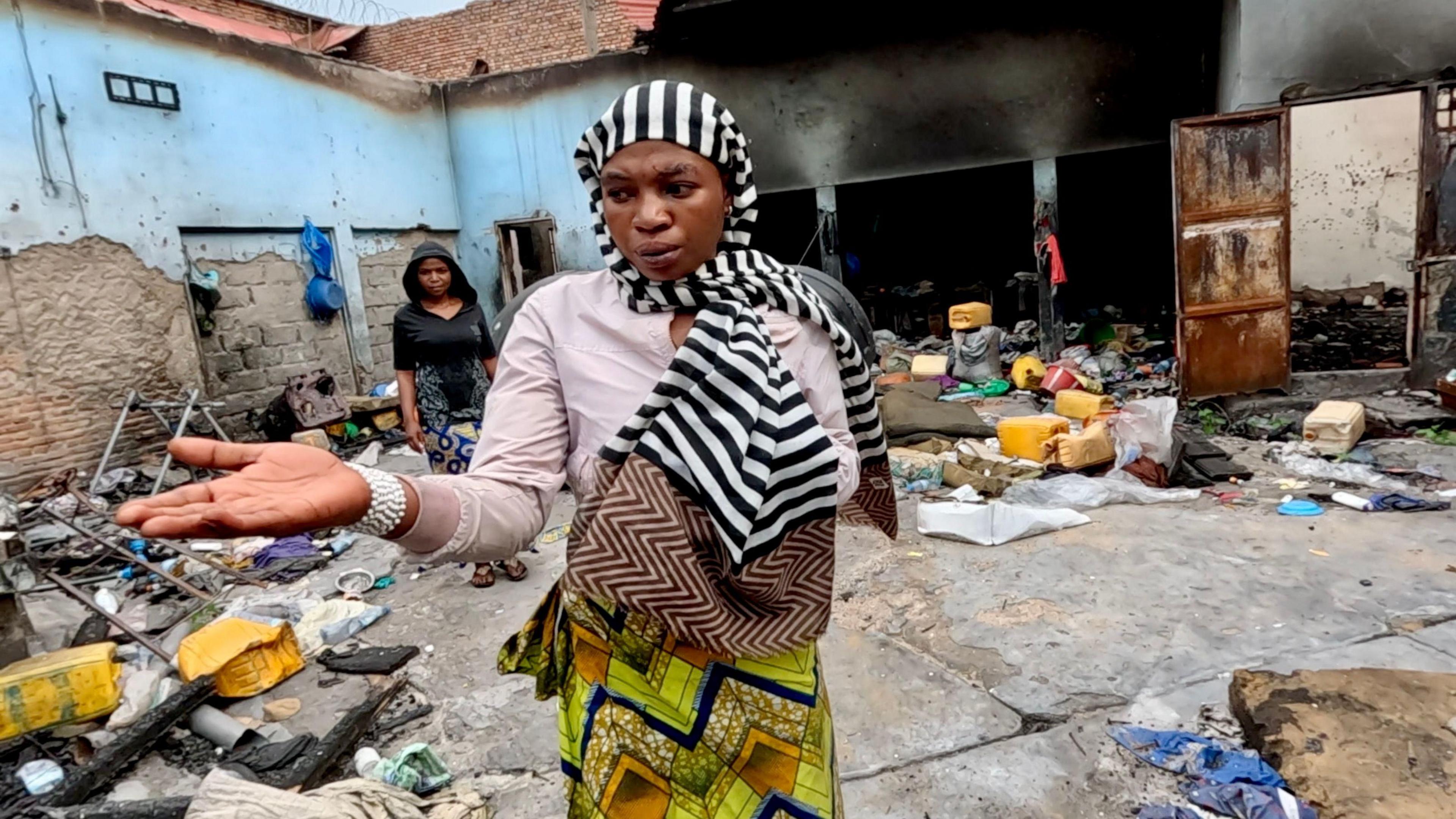 Pascaline gestures outside prison