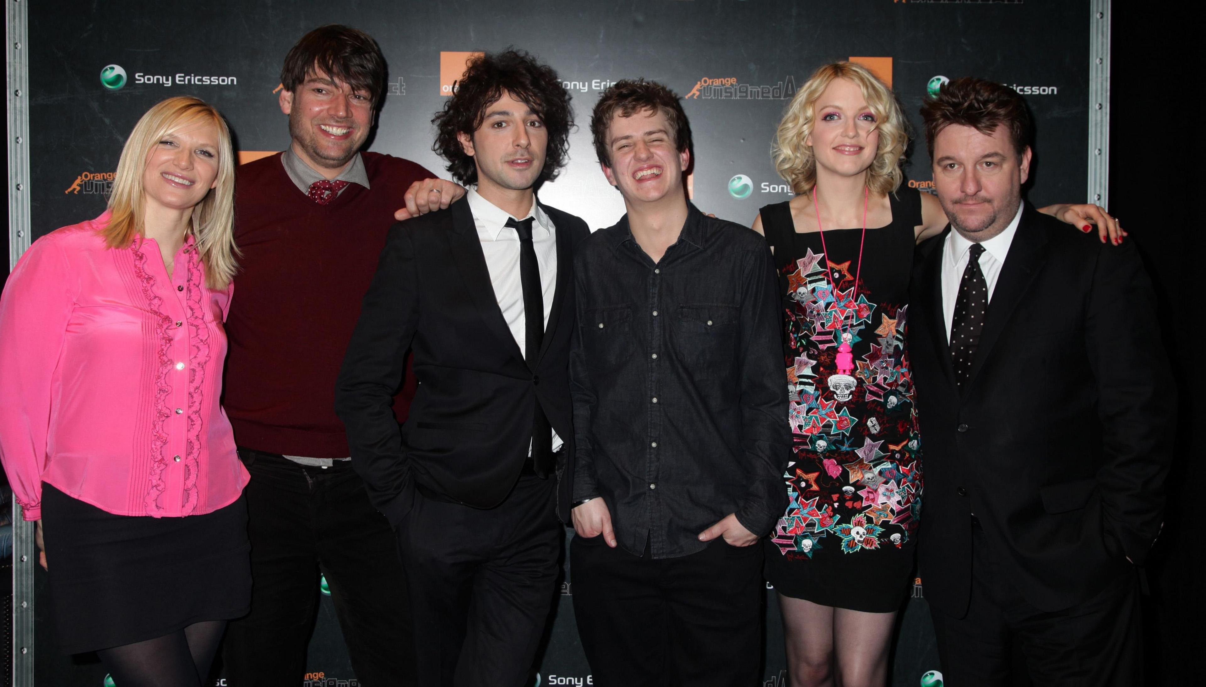 Tommy Reilly (3rd R), aged 19 from Glasgow, is crowned the winner of the Orange Unsigned Act - and has signed a record deal with A&M / Universal - with the judges of the competition (L-R) Jo Whiley, Alex James, Alex Zane, Tommy Reilly, Lauren Laverne and Simon Gavin, Head of A&M Records, at Riverside Studios in Hammersmith, west London.