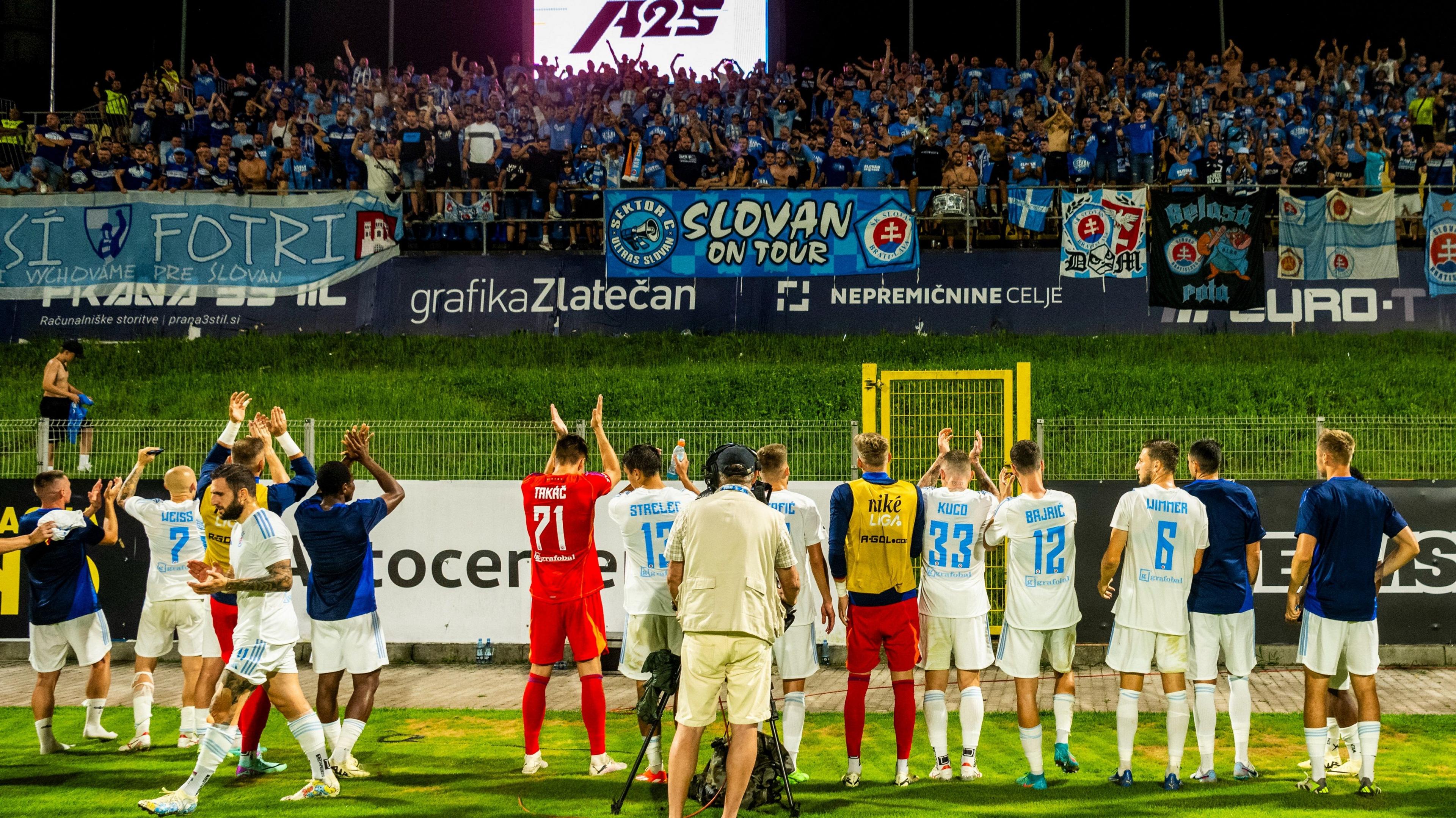 Slovan players celebrate with the club's suppporters