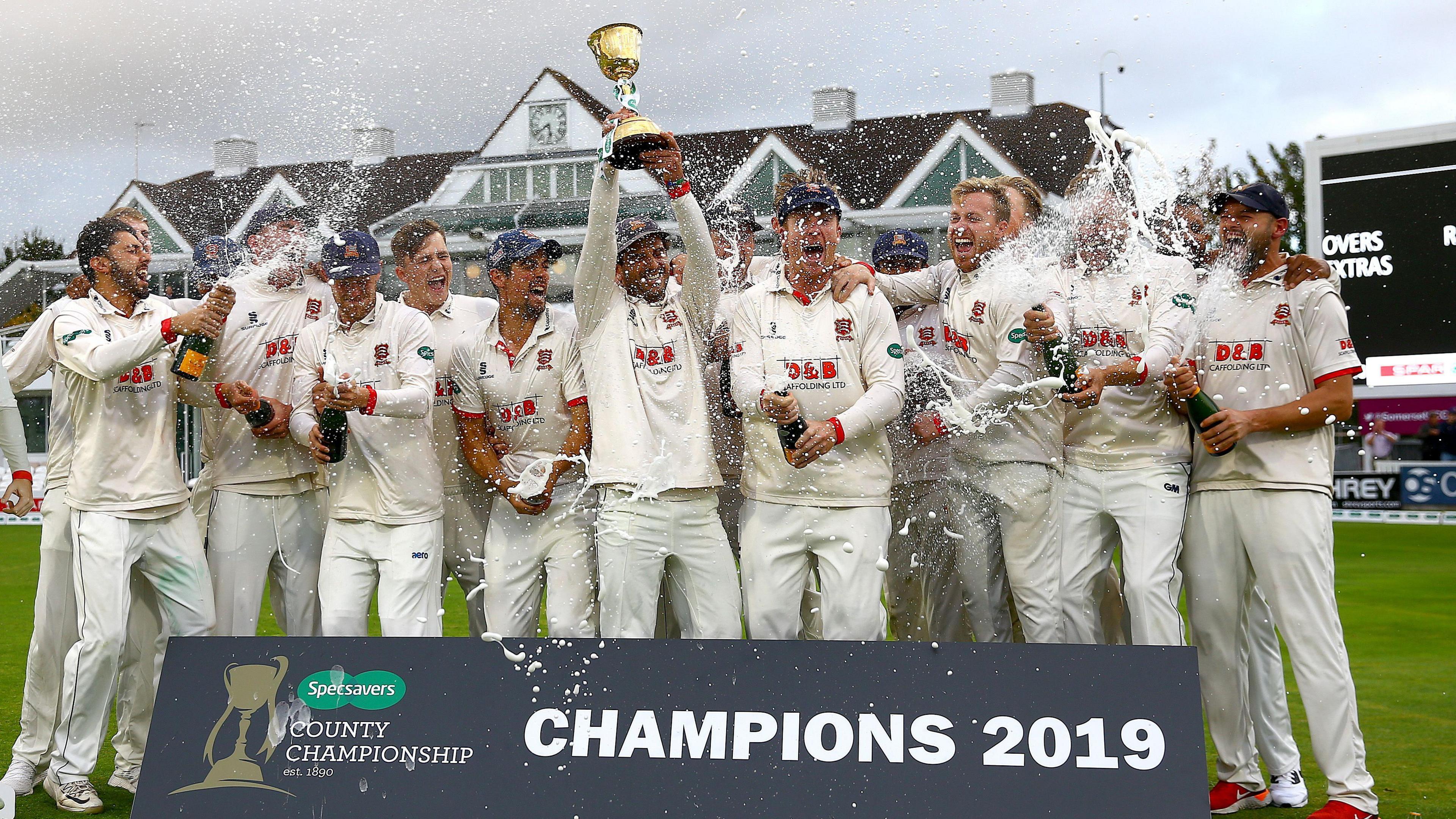 Essex players hold aloft the County Championship trophy at Taunton in September 2019