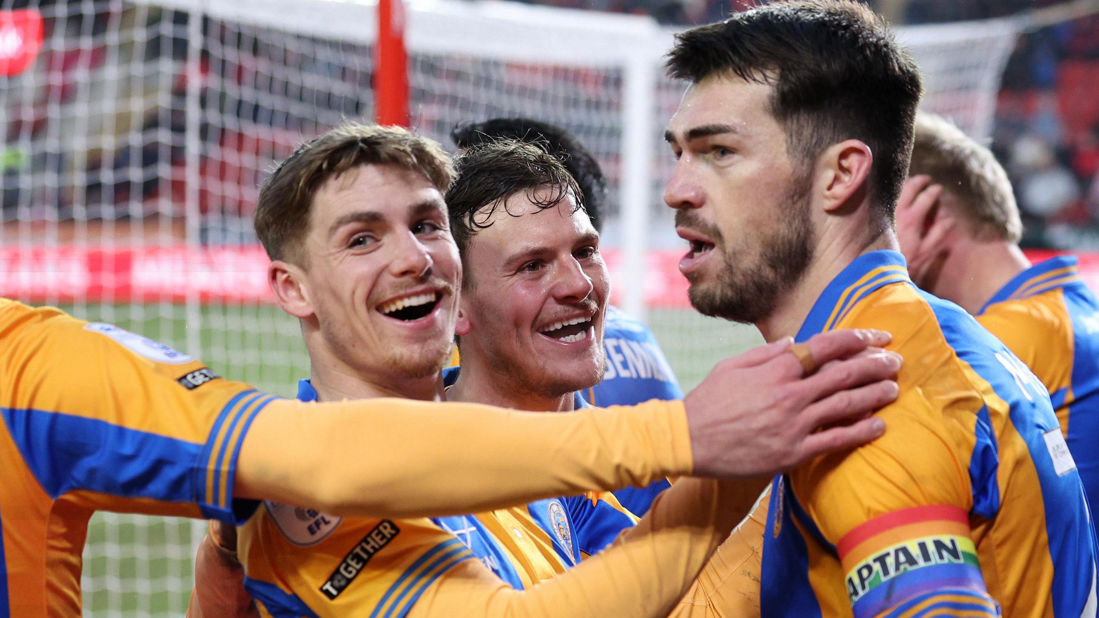 John Marquis celebrates his fourth goal in Shrewsbury's last five games