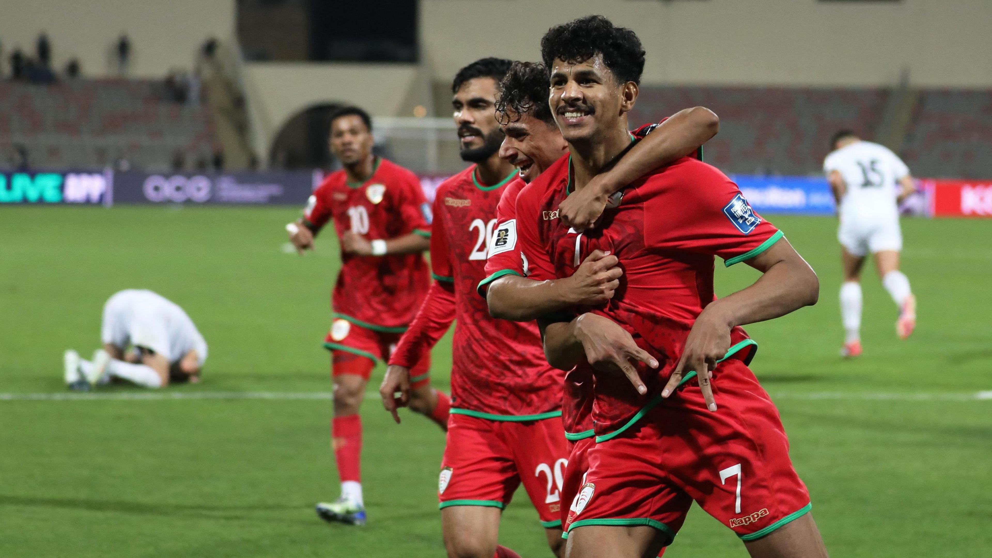 Oman celebrate a goal
